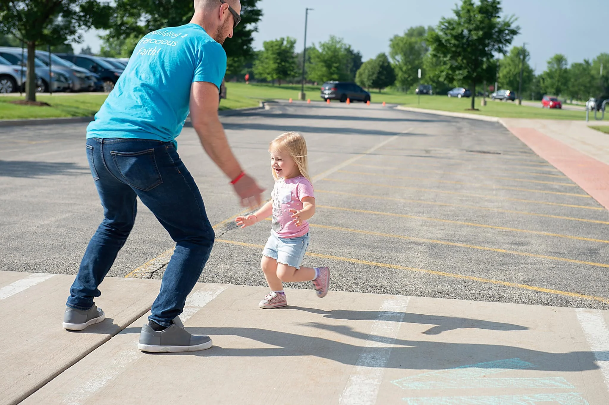 Little girl running to her dad