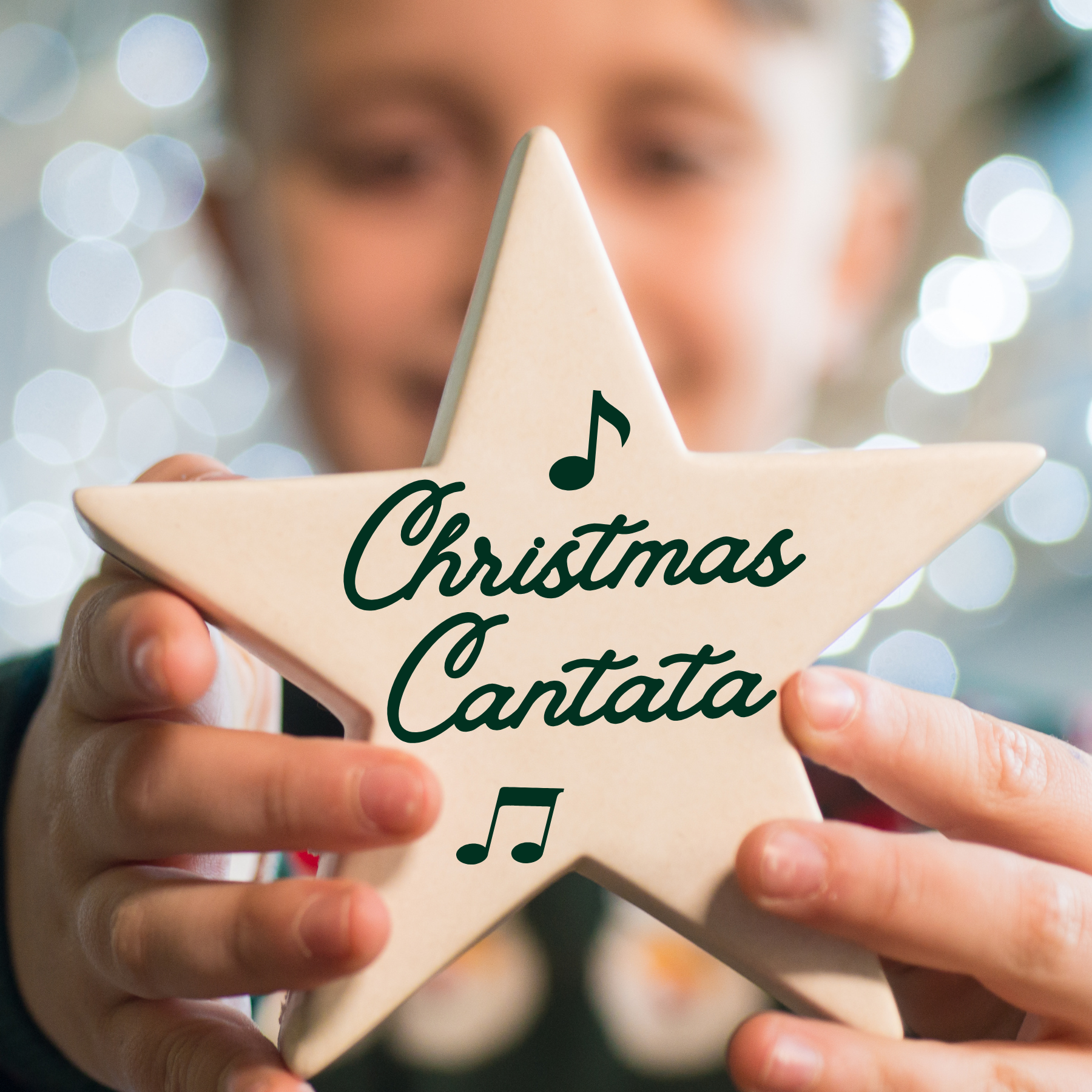 Little boy holding a star with "Christmas Cantata" written on it