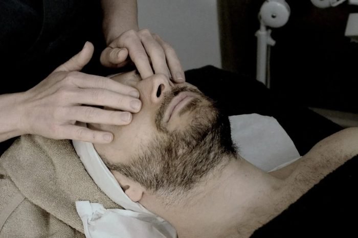 Man receiving a facial service