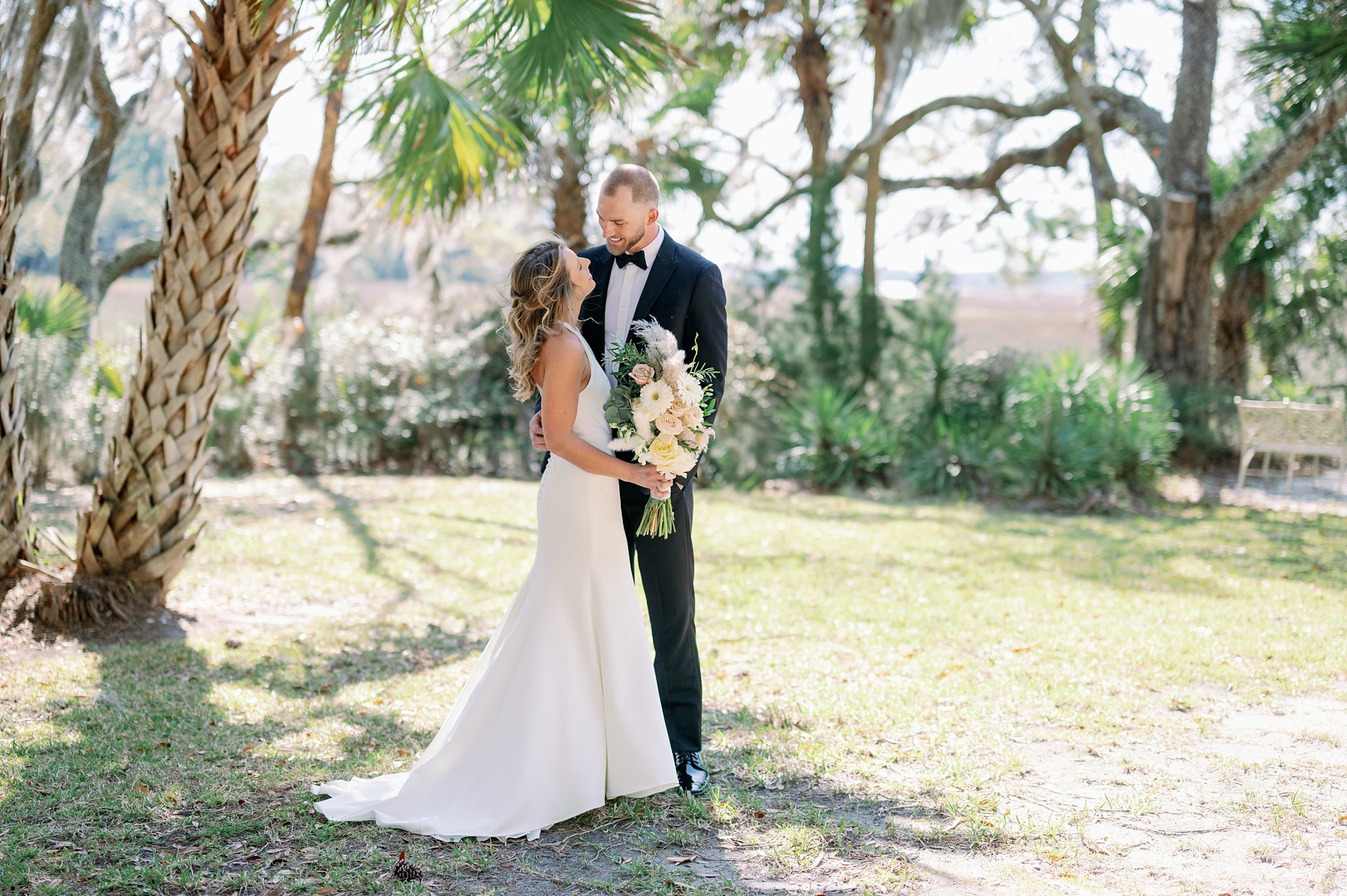 Wedding on the waterfront in Beaufort South Carolina at Callawassie Island neutral floral simple elegant bridal gown