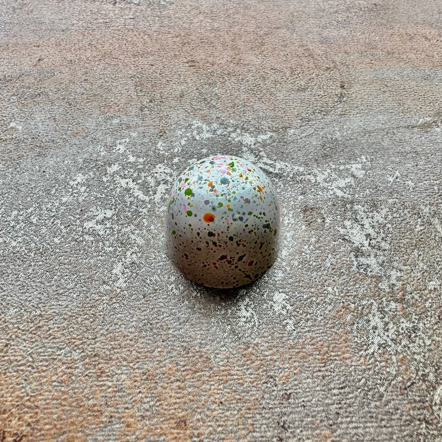 White colorfully speckled bonbon