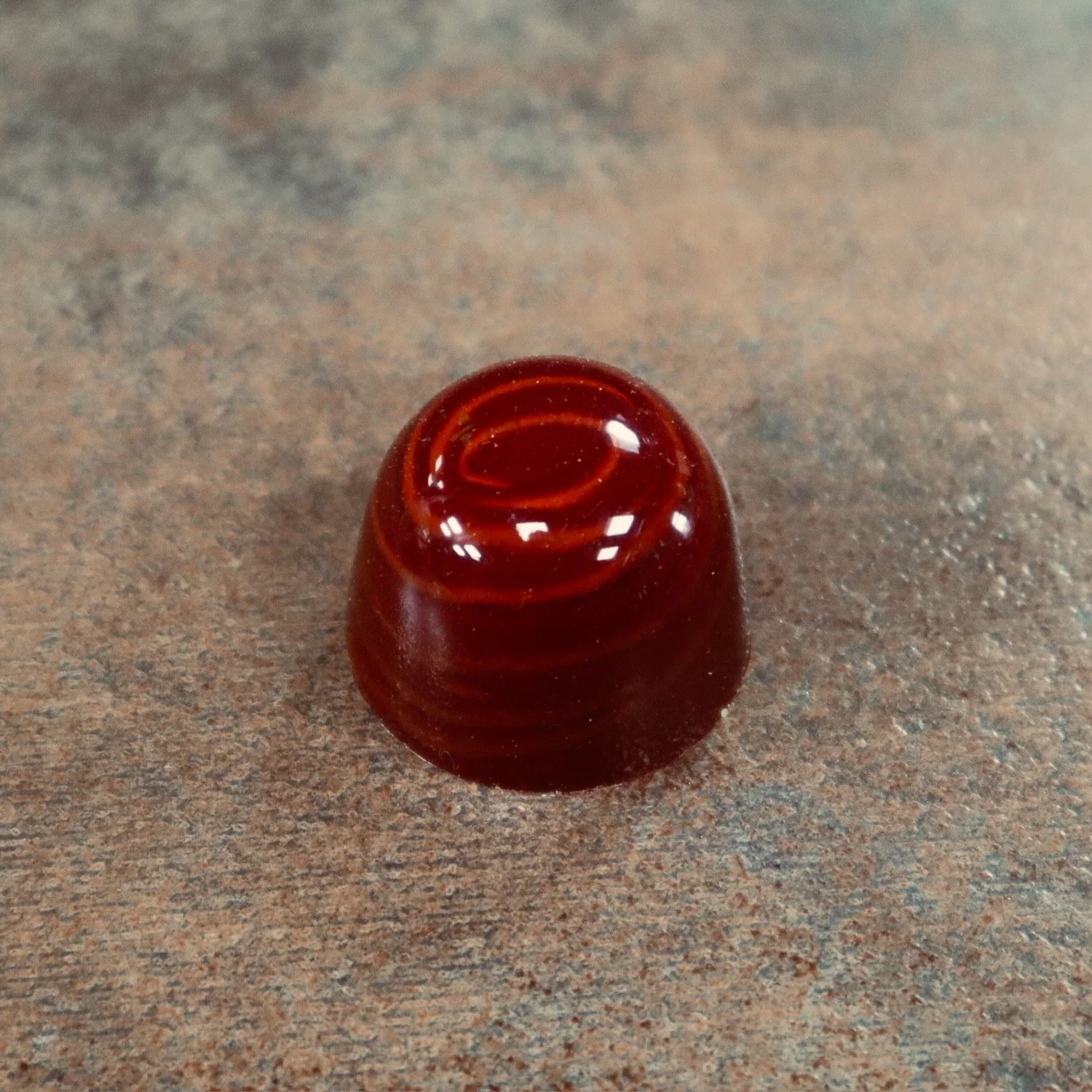 Dark red domed bonbons