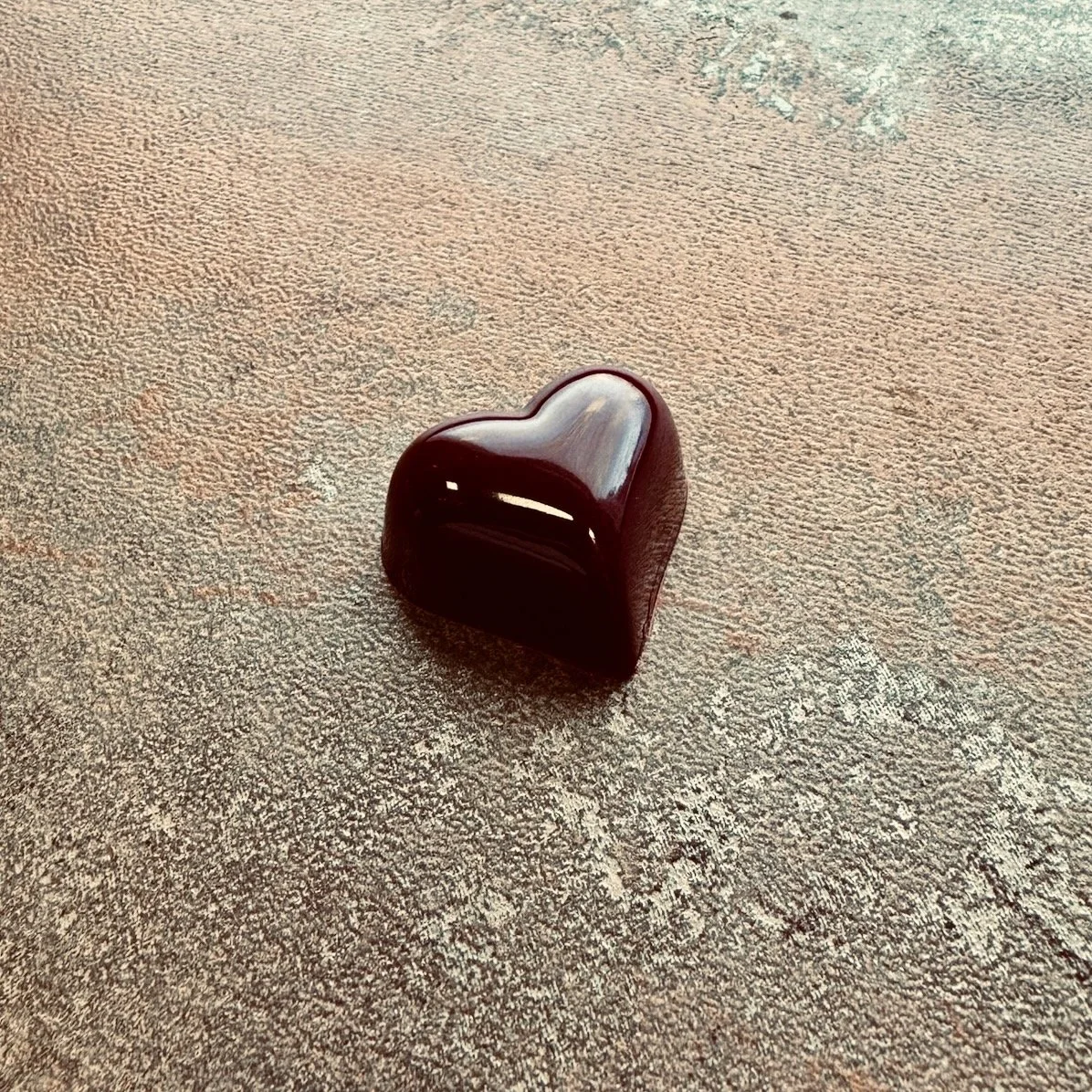 Very dark red heart shaped bonbon