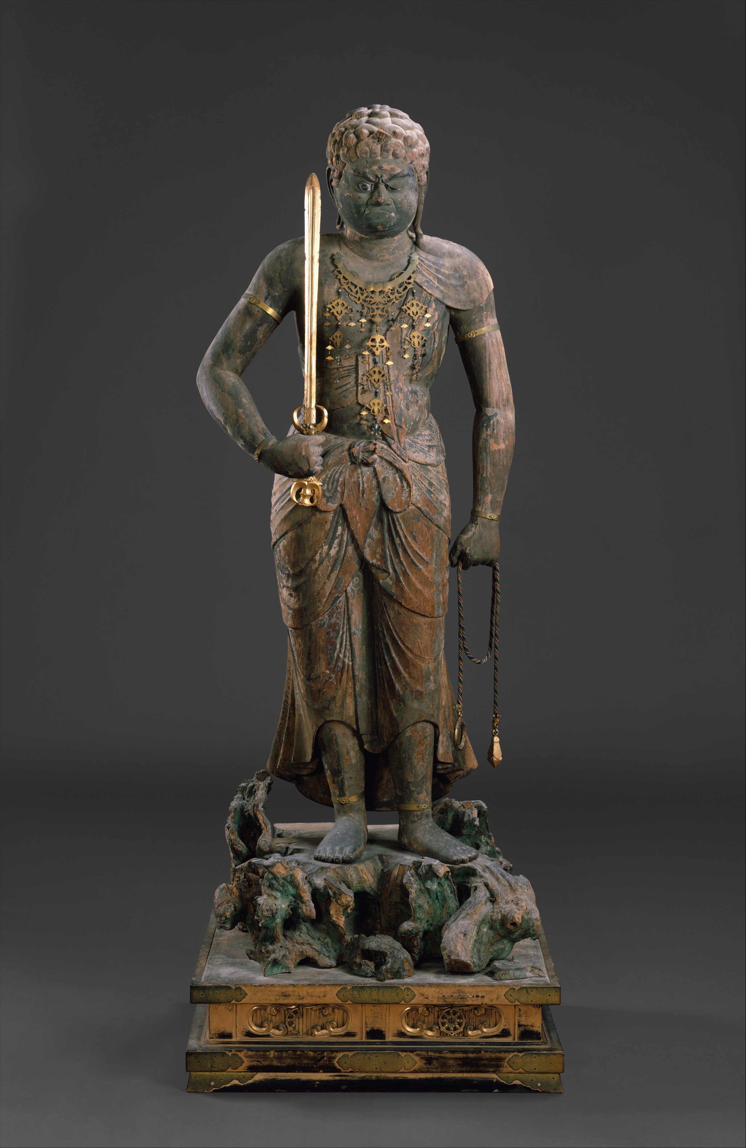 A statue of the Buddhist deity Fudo Myoo in a standing position