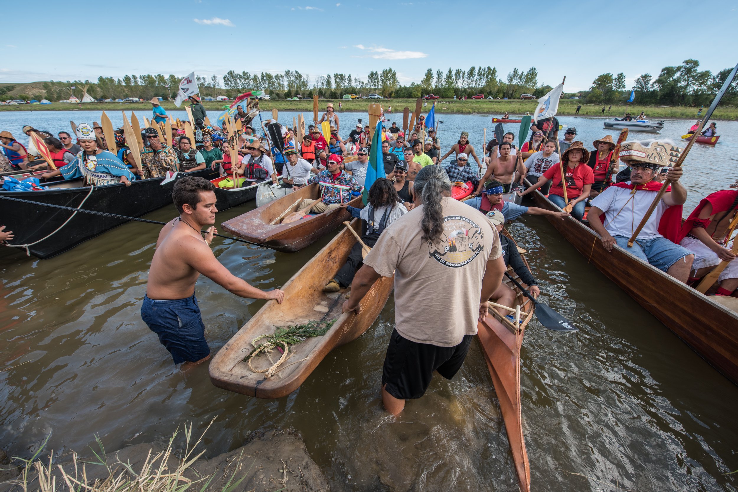  Tribes from the Pacific Northwest brought with them their traditional hand-carved canoes. In September of that year protestors - indigenous and non-indigenous alike,  participated in the re-enactment of a traditional Native ceremony when boats from 