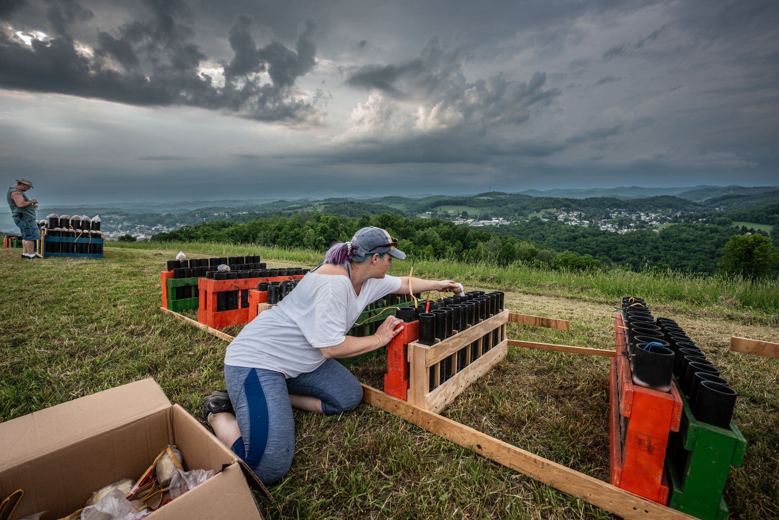 Melissa Garvin loads the smaller tubes.