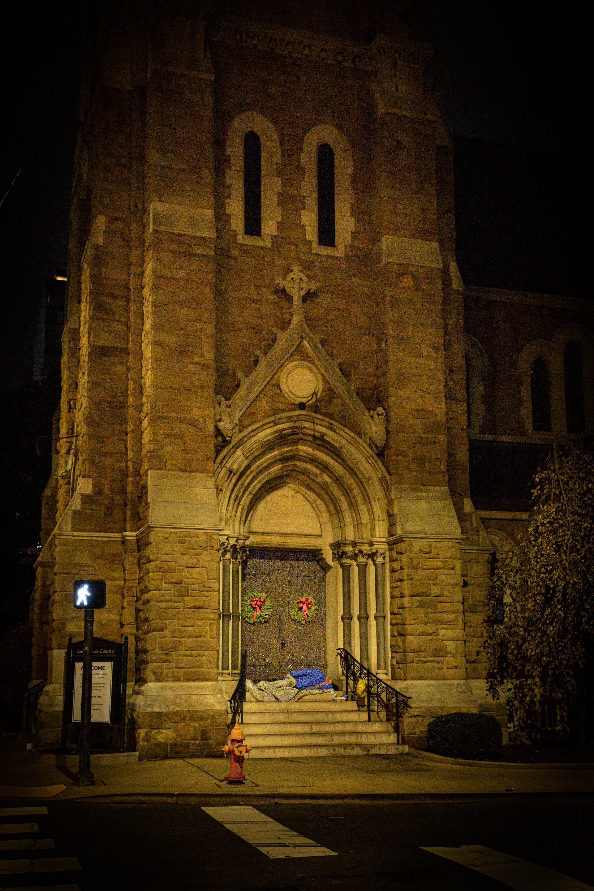  A homeless man takes refuge on the concrete steps of one of the entrances to Christ’s Church Cathedral on upper Broadway in Nashville, Tennessee. Each night the church leaves blankets on each of the steps. 