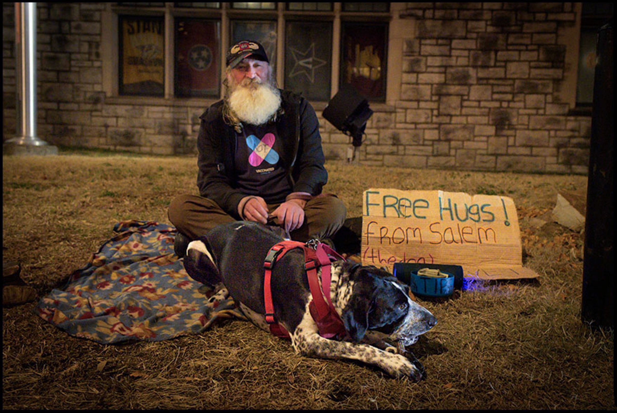  Kevin, and his dog, Salem sit Oon the front lawn of Hume-Fogg High School, along upper Broadway in Nashville, Tennessee,  Salem came into Kevin’s life under a tiwist of events that make’s one believe in desitiny. 