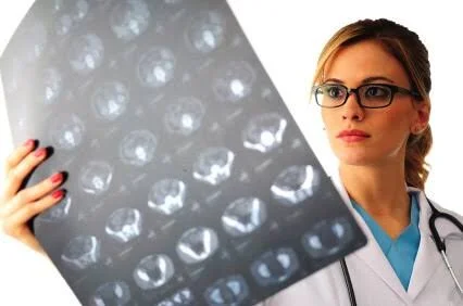 Clinician Maintains Ernest Expression While Viewing MRI Images