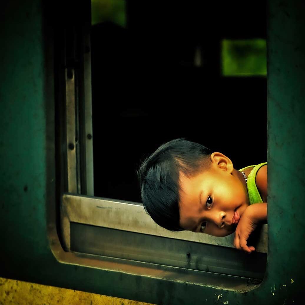 Young boy on a train in Hua Hin station, Thailand