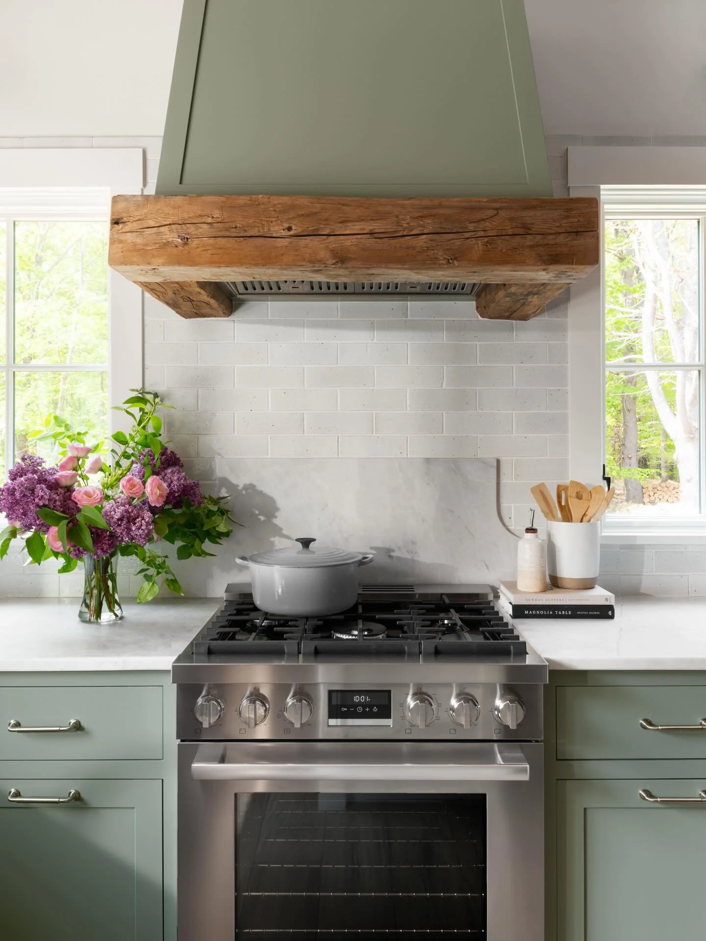 Oops &mdash; we missed St. Patrick&rsquo;s Day by a day.. or three? 🍀 Our version of wearing green:

This kitchen features soft green cabinetry, a rustic reclaimed wood hood detail, and crisp white tile that keeps the whole space feeling fresh and t