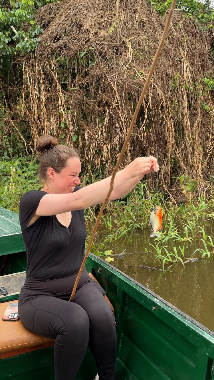 Traveler fishing for piranhas