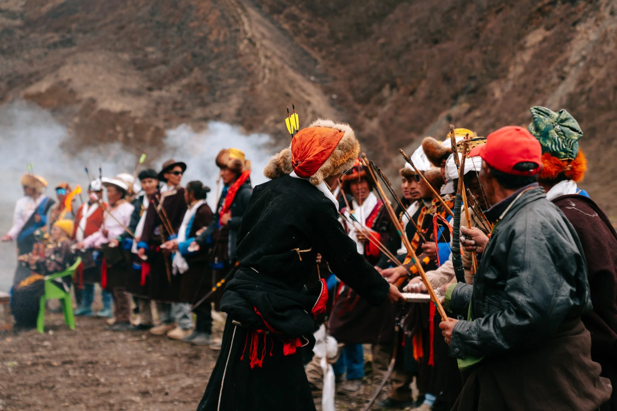 Archery on the Saga Dawa field. Juniper smoke fills the air.