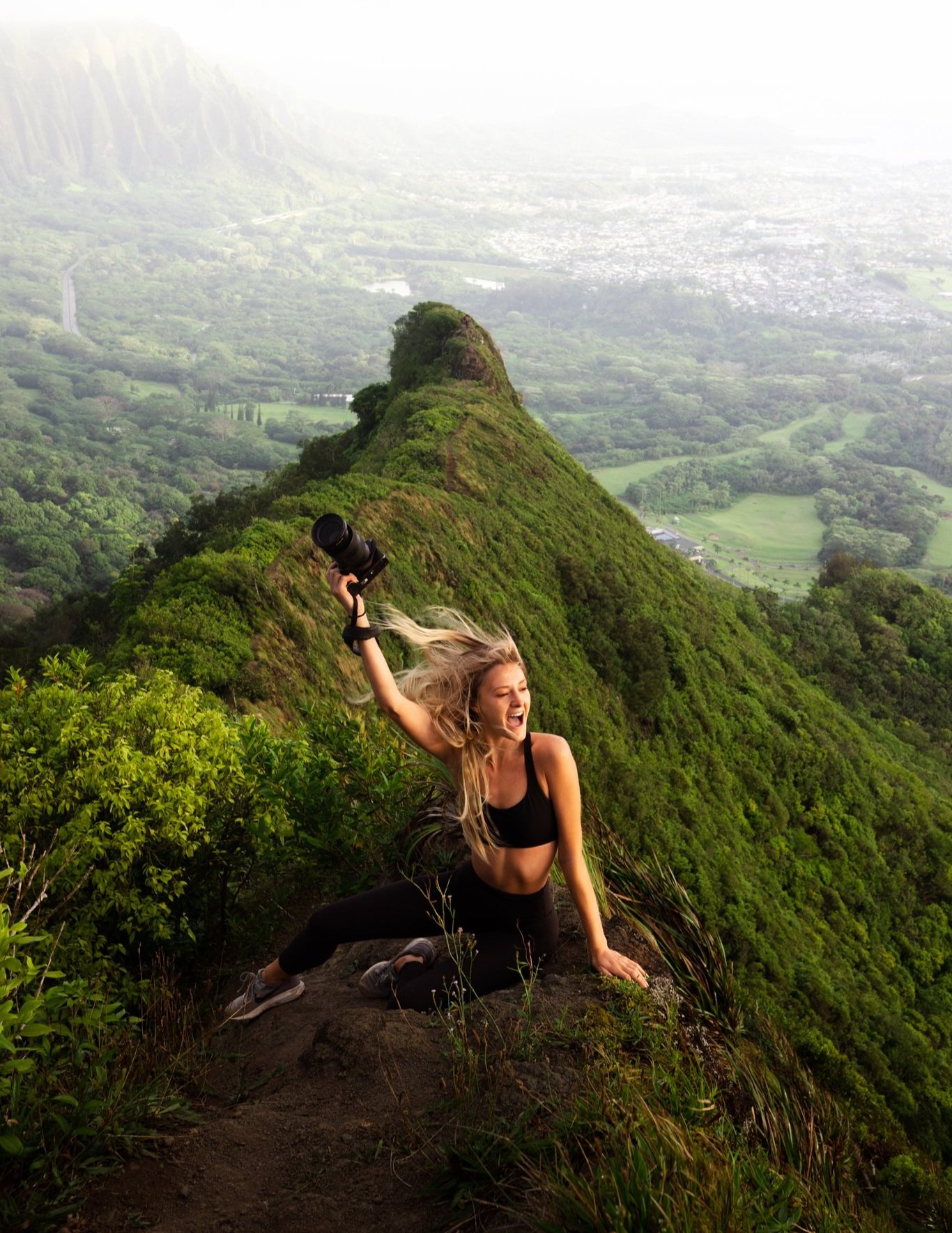 Karlie Place shooting with her Sony A7IV on the beach — solo female travel content creator