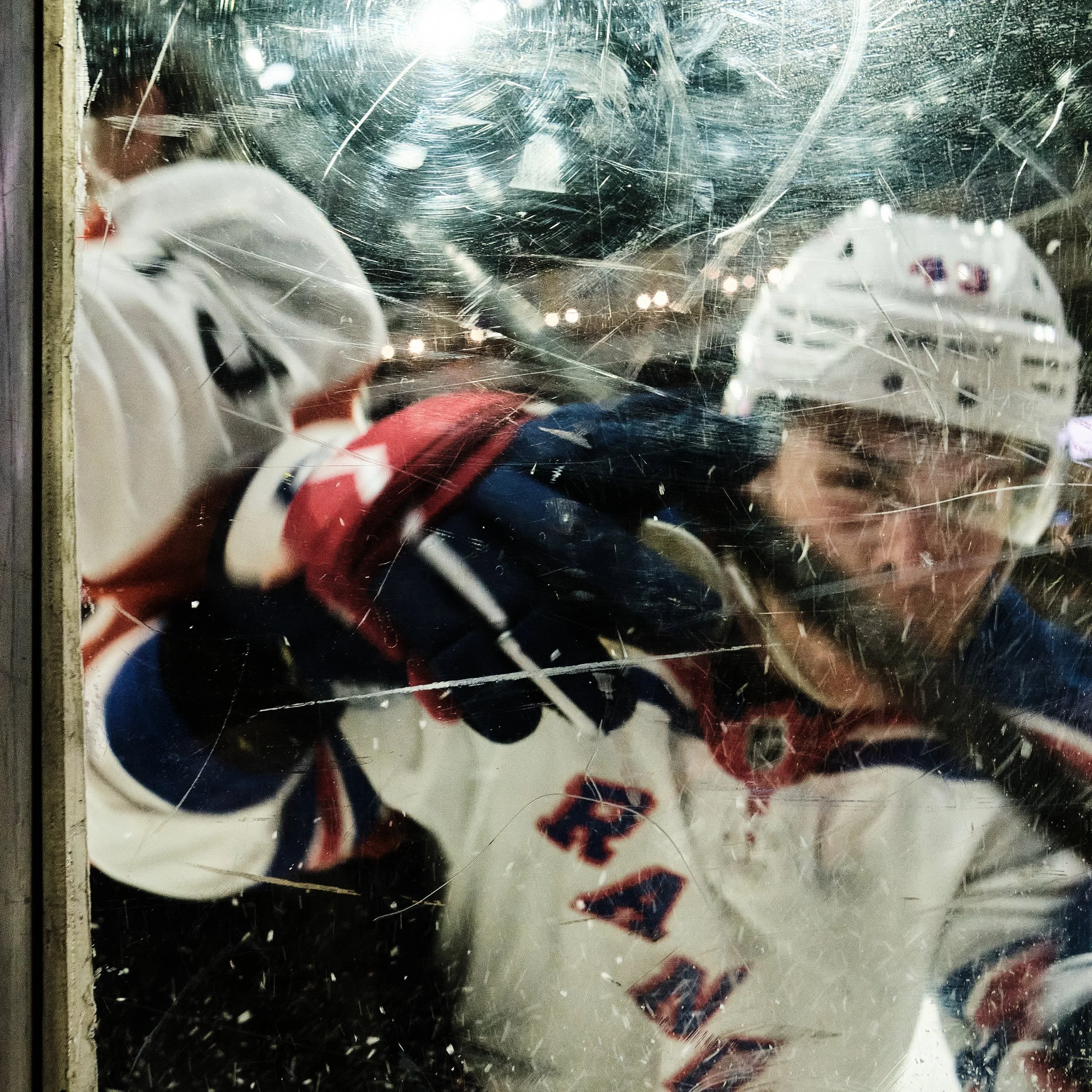 A New York Ranger slams into the rink's plexiglass walls during the rookie series game at the PPL Center with the Philadelphia Flyers in Allentown, P.a. on Friday, September 12, 2025.