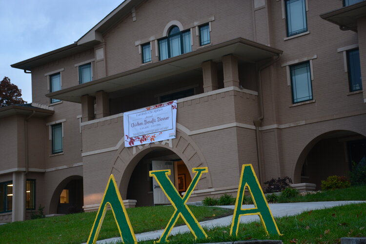 Front of the Lambda Chi Alpha Fraternity house during a past year's Chicken Benefit Dinner