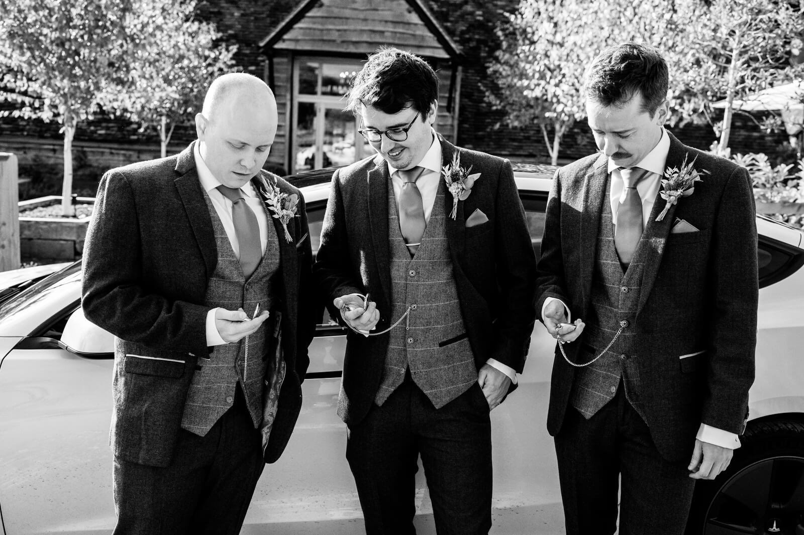 candid photography of groomsman at silchestsr farm wedding venue