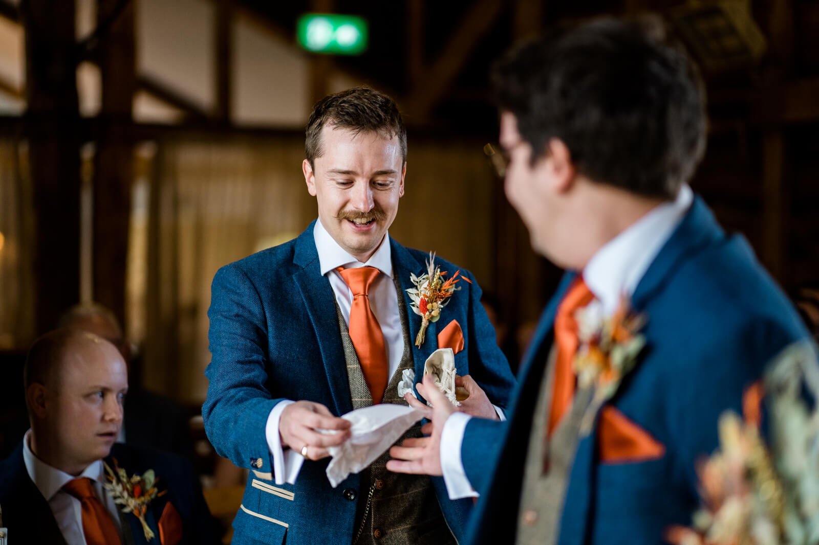 best man hands groom a tissue during ceremony silchester farm