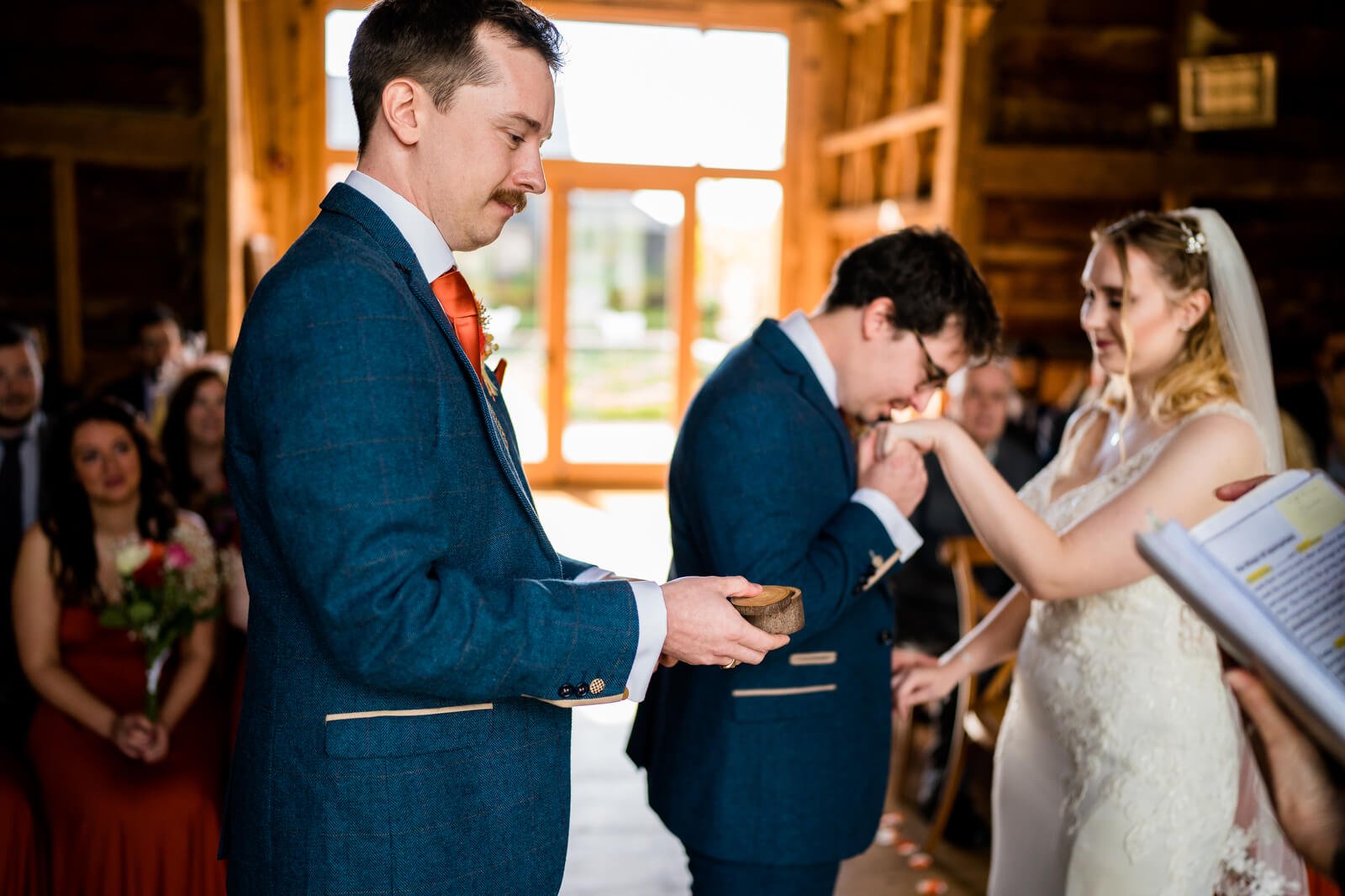 candid wedding photo at ceremony in silchester farm barn