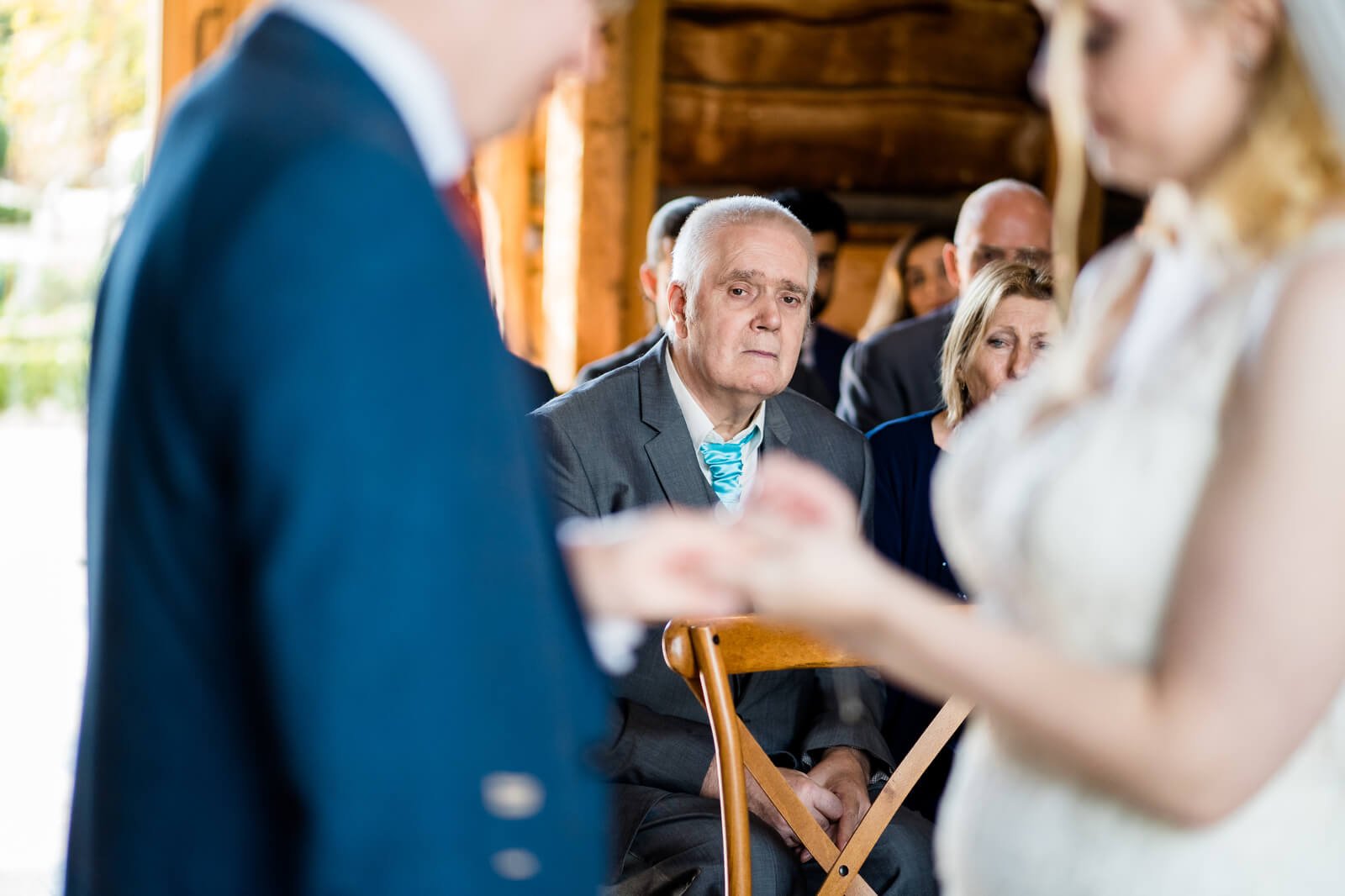 father watches daughter during ceremony at silchester farm