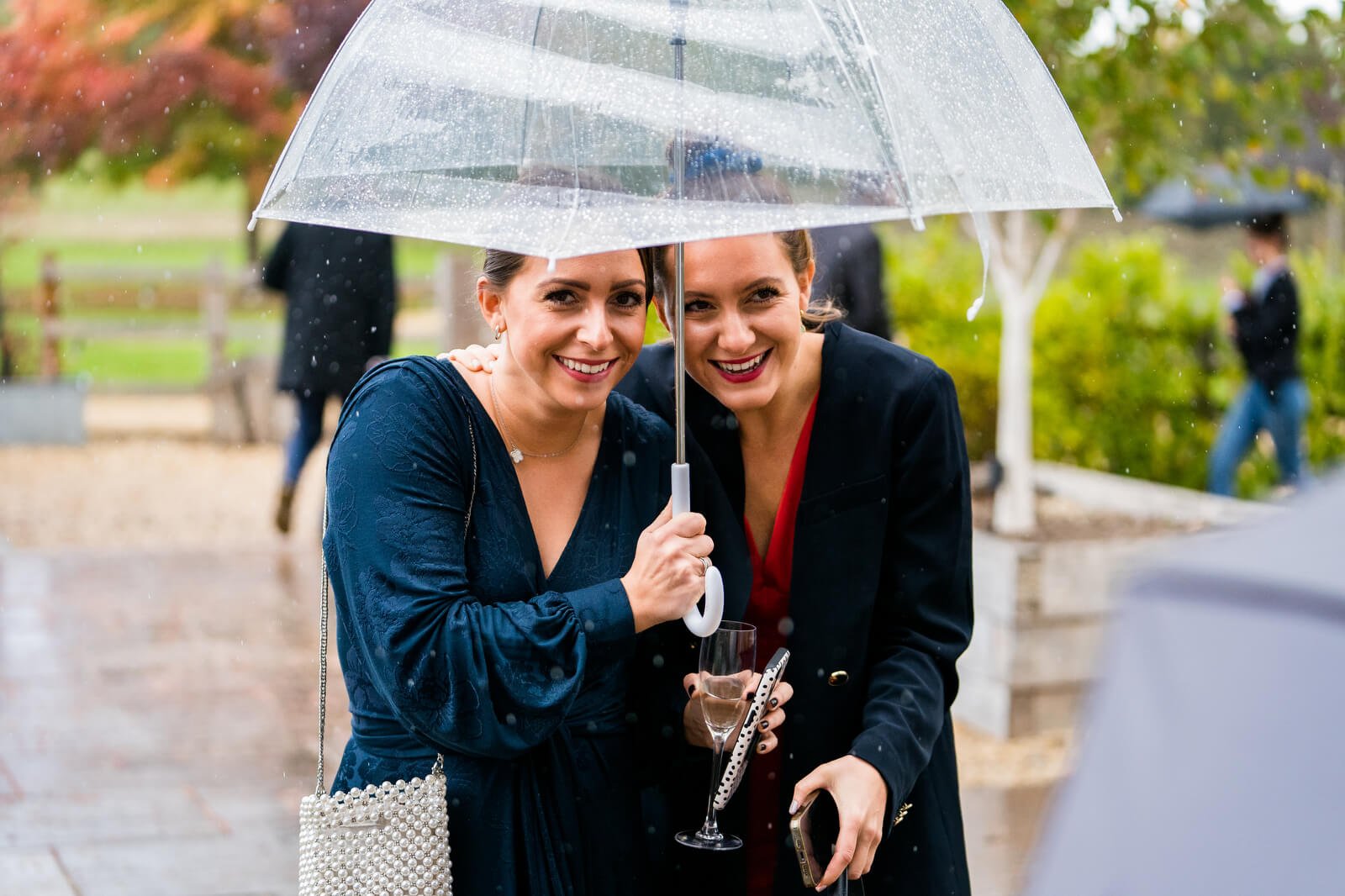 candid wedding photo in the rain at silchester farm