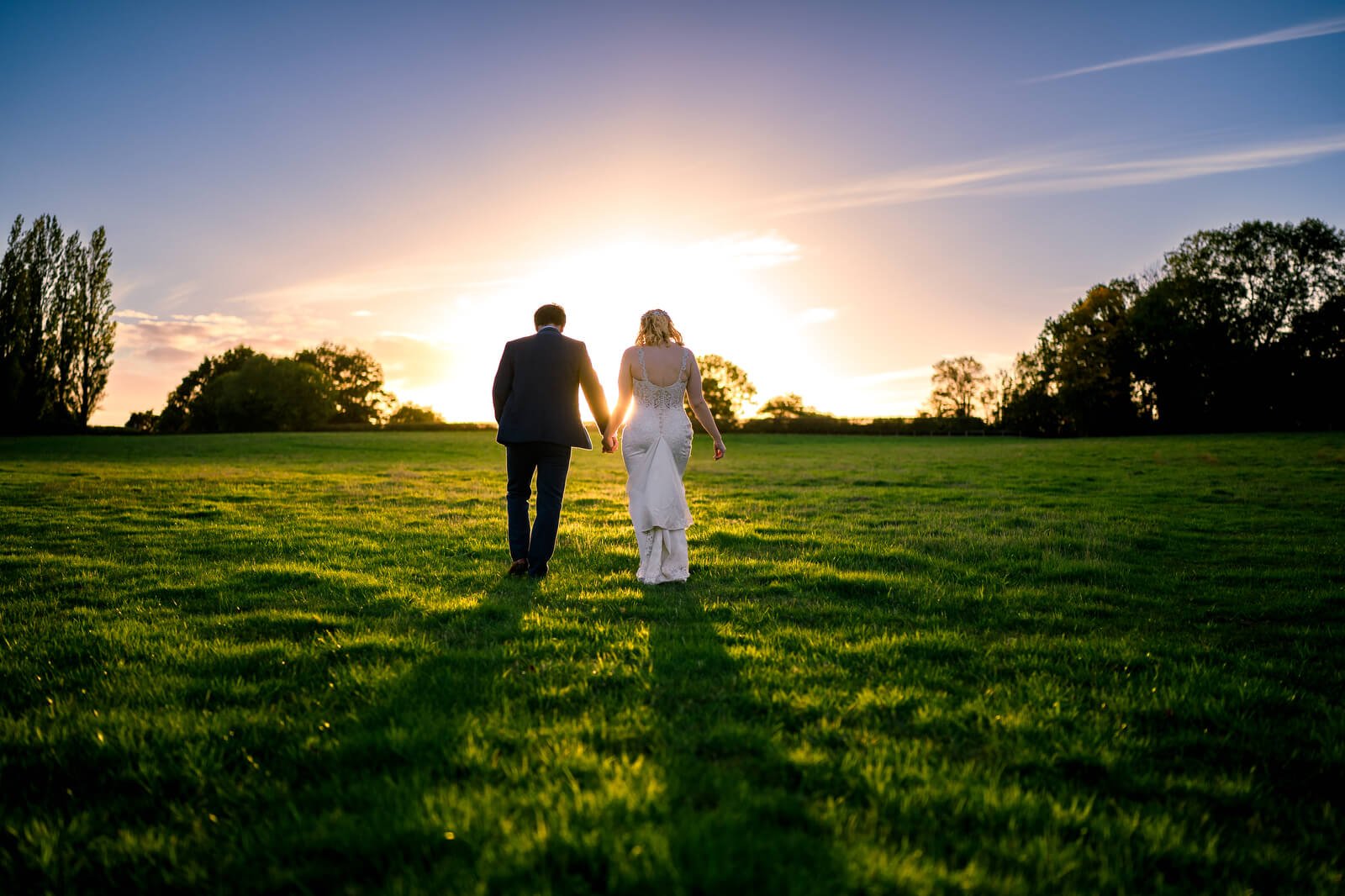 sunset photos in field at silchester farm by wedding photographer Joe Lillywhite 