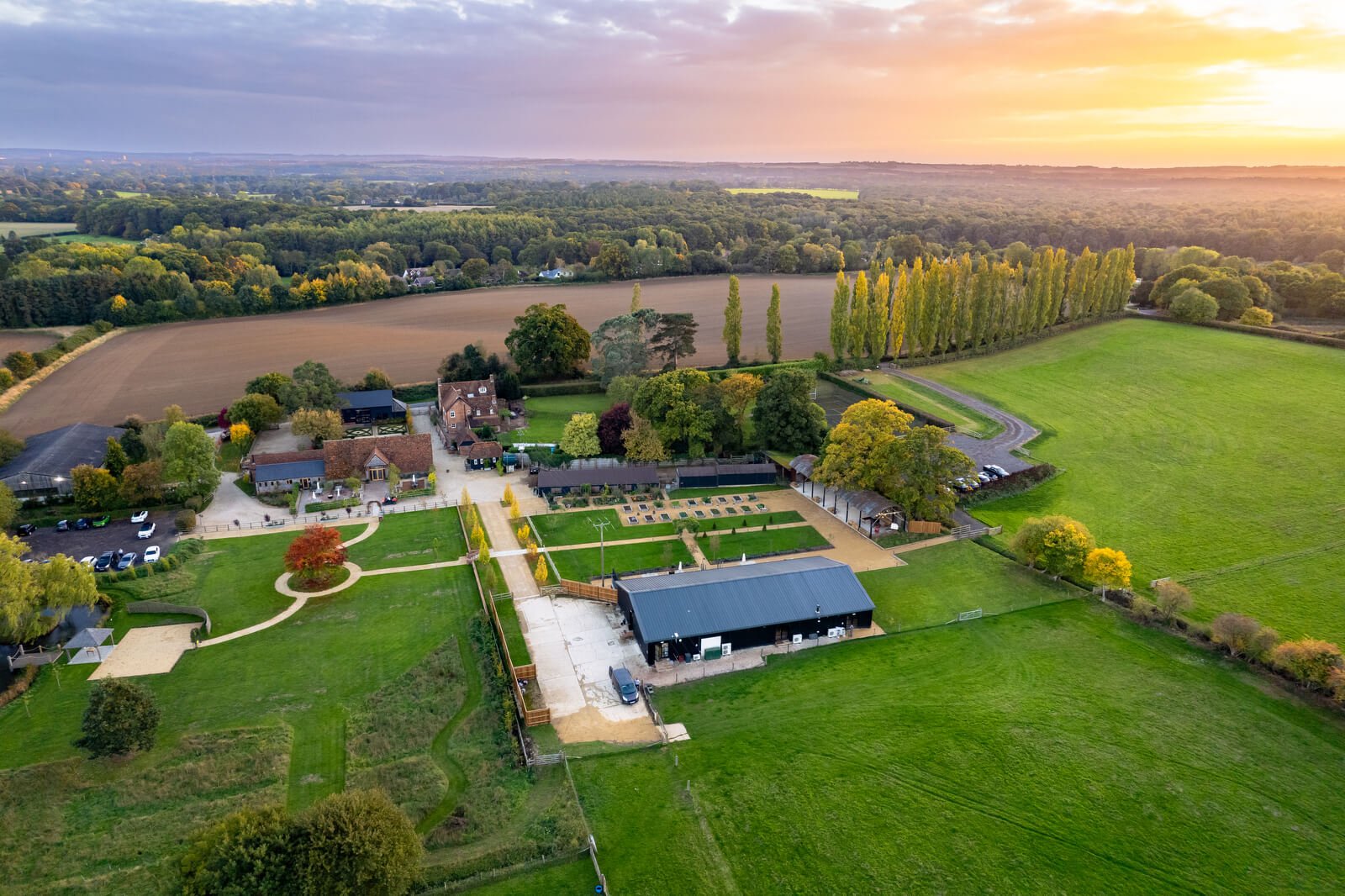 drone aerial photo of silchester farm during sunset