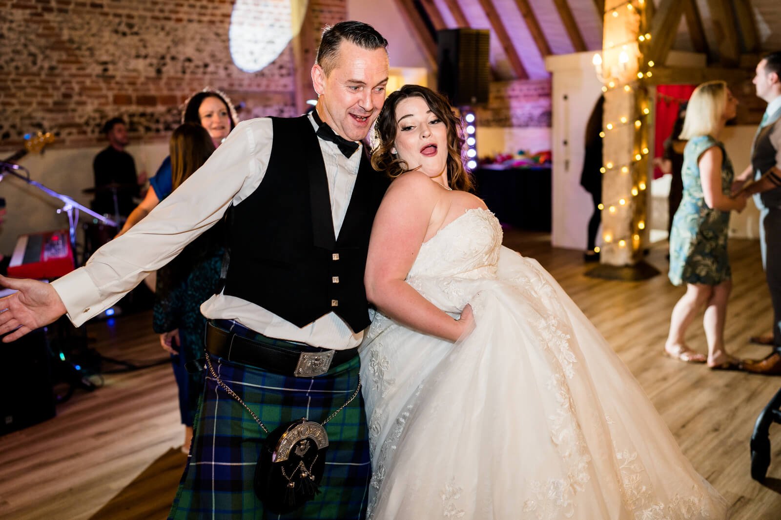 bride dancing with best man at barford park wedding venue with band the deloreons