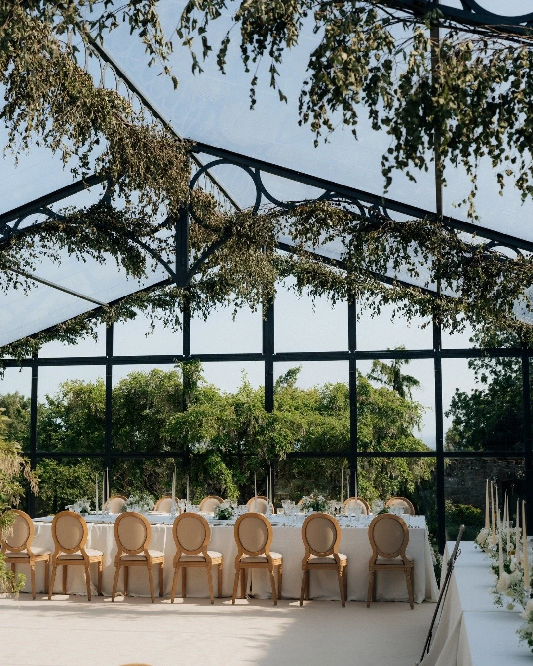 Nia &amp; Tyler&rsquo;s incredible wedding reception at the Glenmorangie House embraced the refined grandeur of the Scottish Highlands - historic stone walls, soft candlelight, and long tables styled beneath a canopy of glass and climbing greenery.

