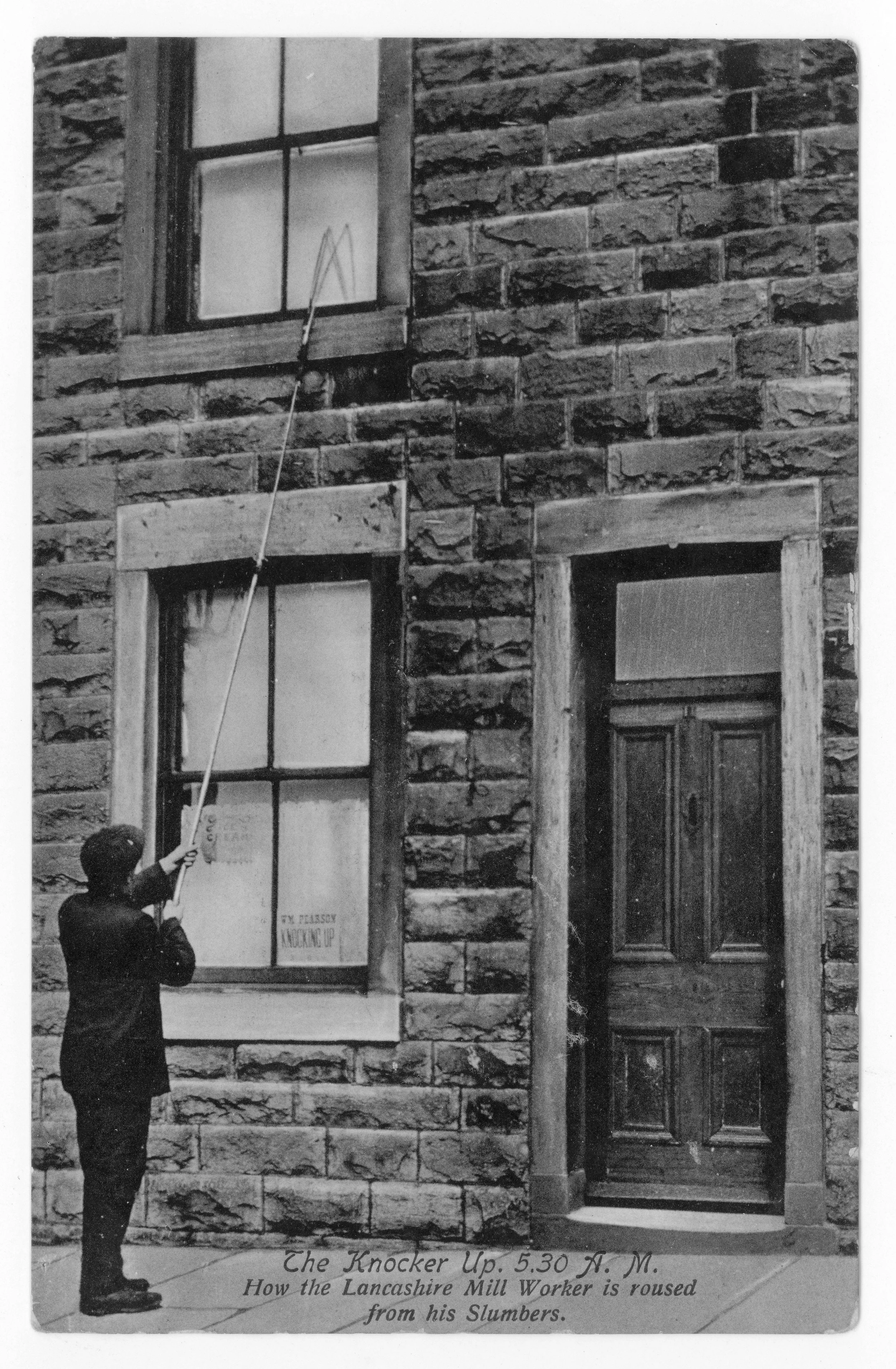 Picture of a person in cap tapping a window with a tall stick