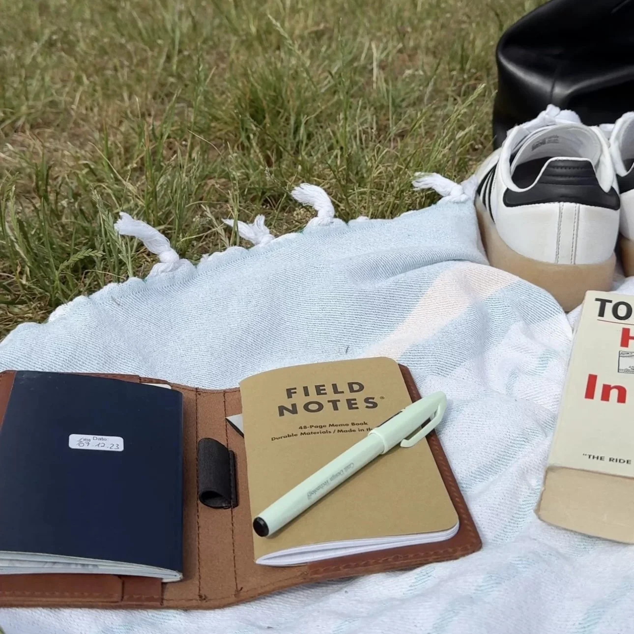 field notes journal on a blanket in Treptower Park
