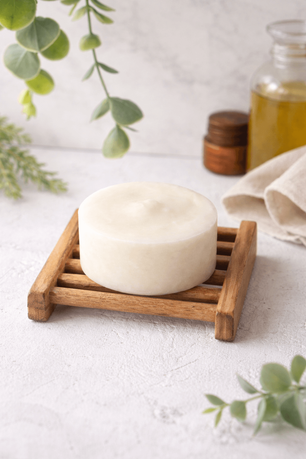 Rosemary shampoo bar unwrapped, with bamboo holder, Okotoks, ab.PNG