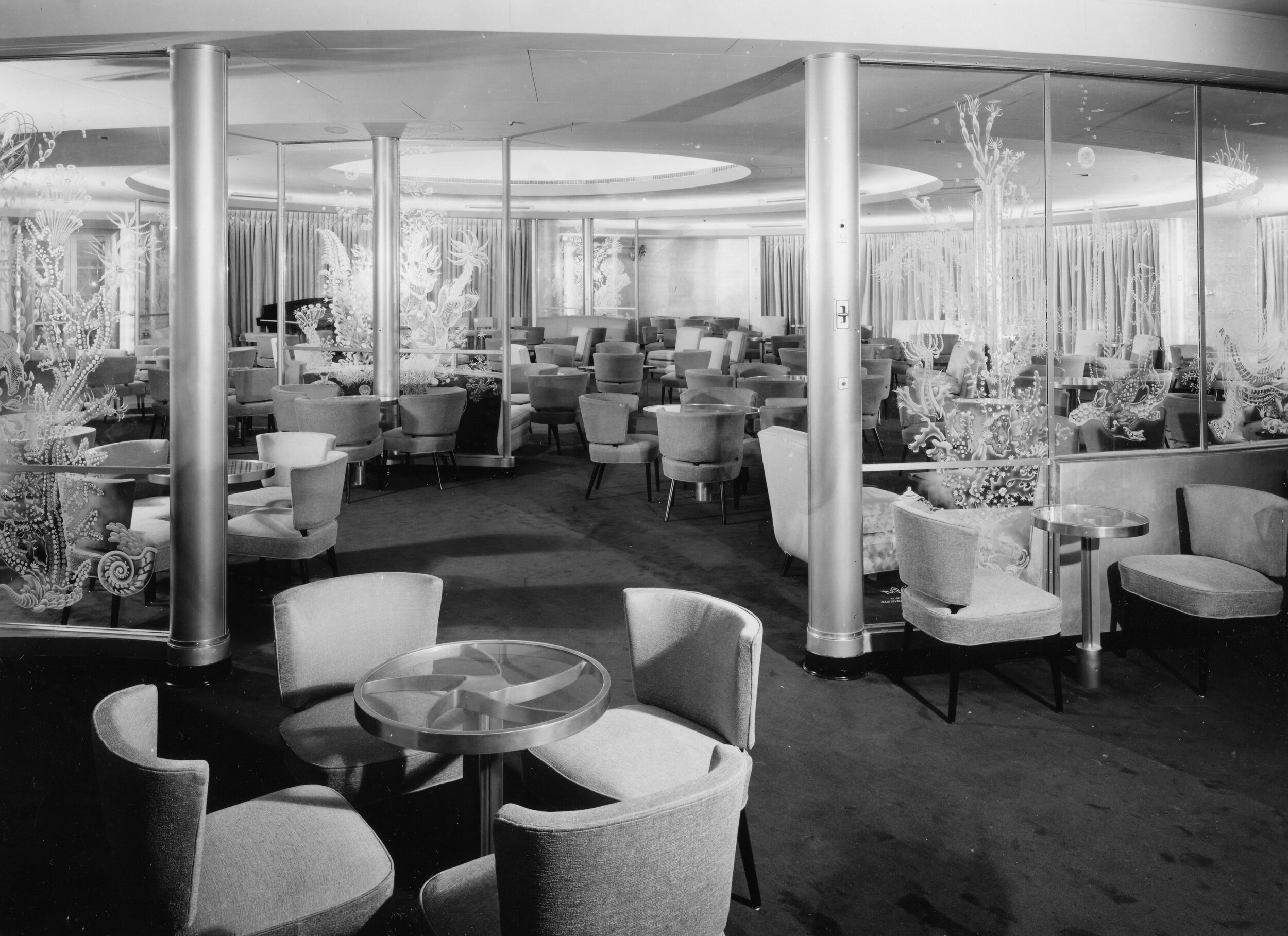The first class ballroom is an example of the ship’s gorgeous mid-century interiors