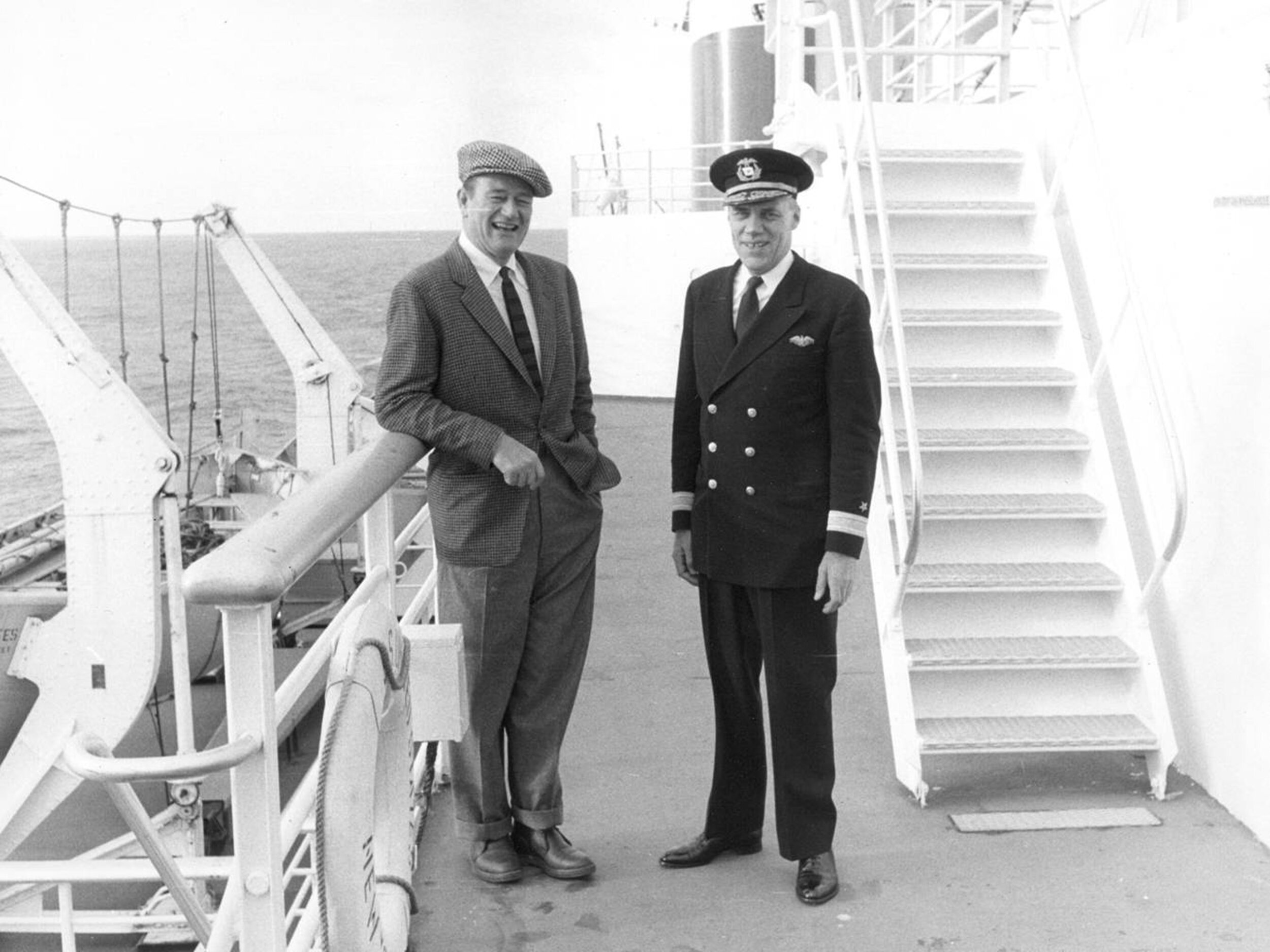 John Wayne and Commodore John Anderson, captain of the SS United States, on deck (Image courtesy of Charles Anderson)