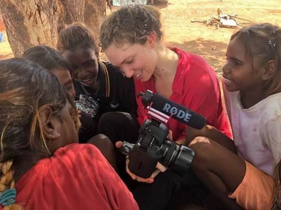 Community First Development volunteer Monique, working with the kids at Yarralin school to create a fun video about going to school. 