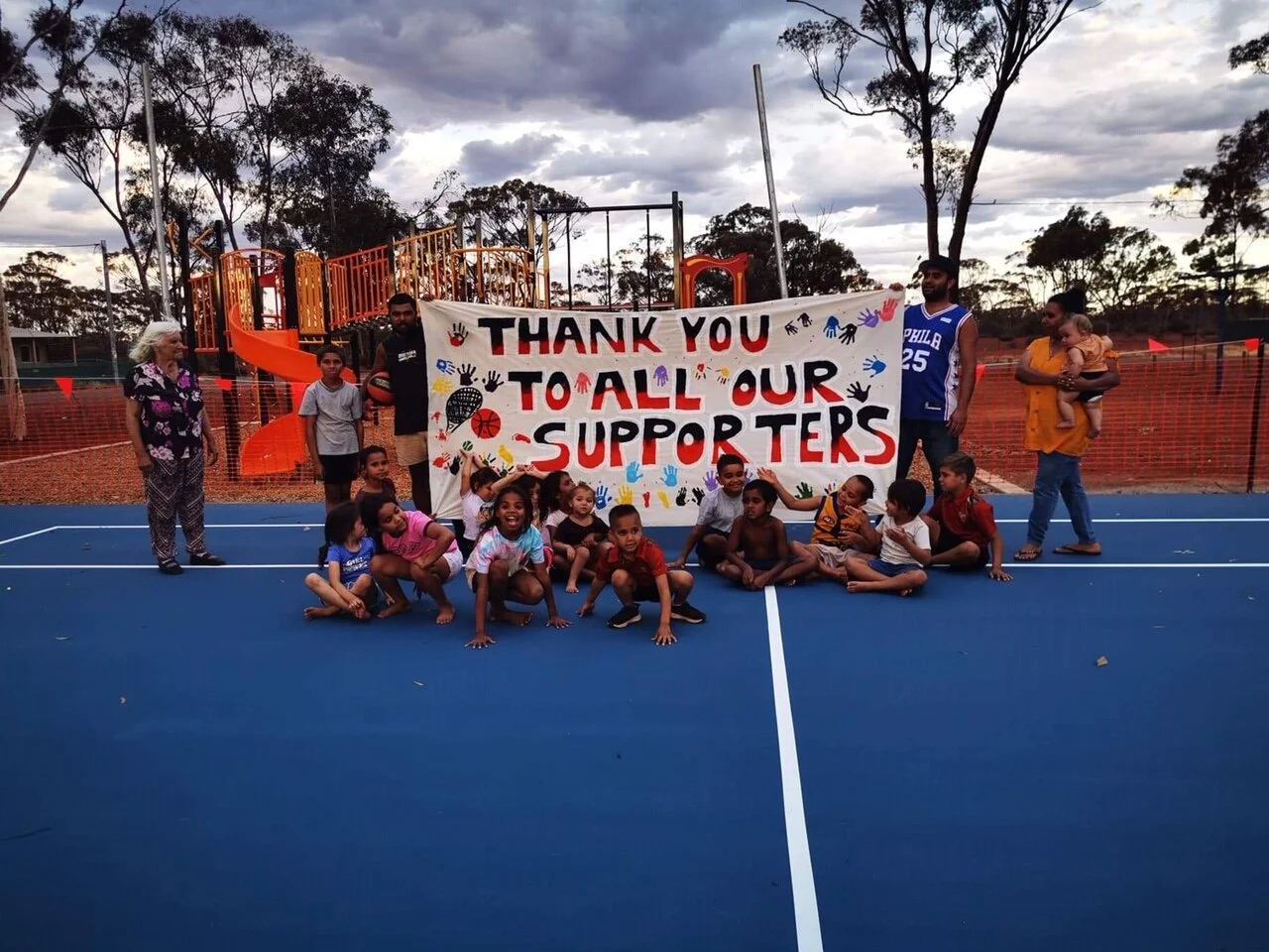  Members of Kurrawang Community thank their supporters after the completion of their new playground and sports courts.  