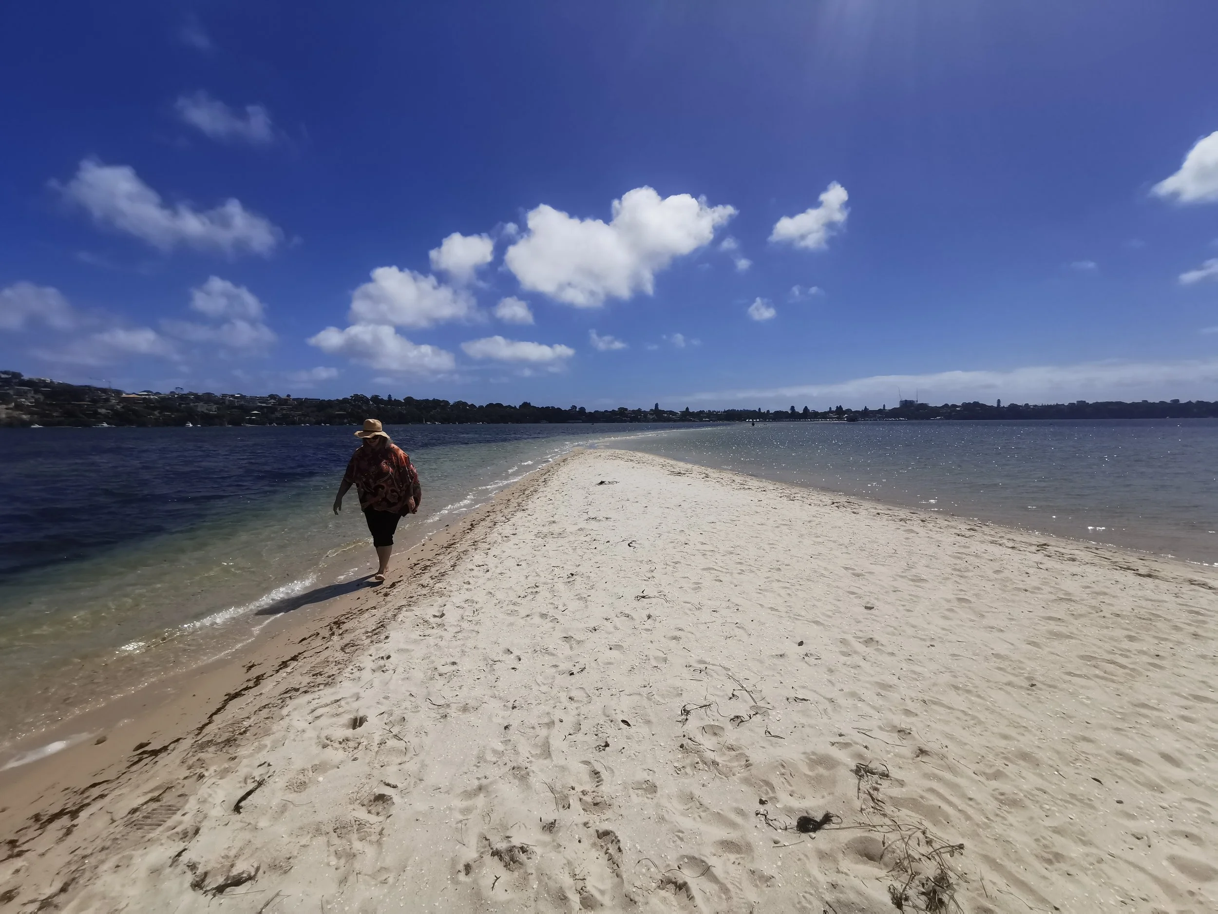  CEO, Steph Harvey, walking on the sands of Dyoondalup.  