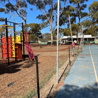    Volunteer Sudharmo in action installing a fence around the Kurrawang Aboriginal Community children’s playground.   