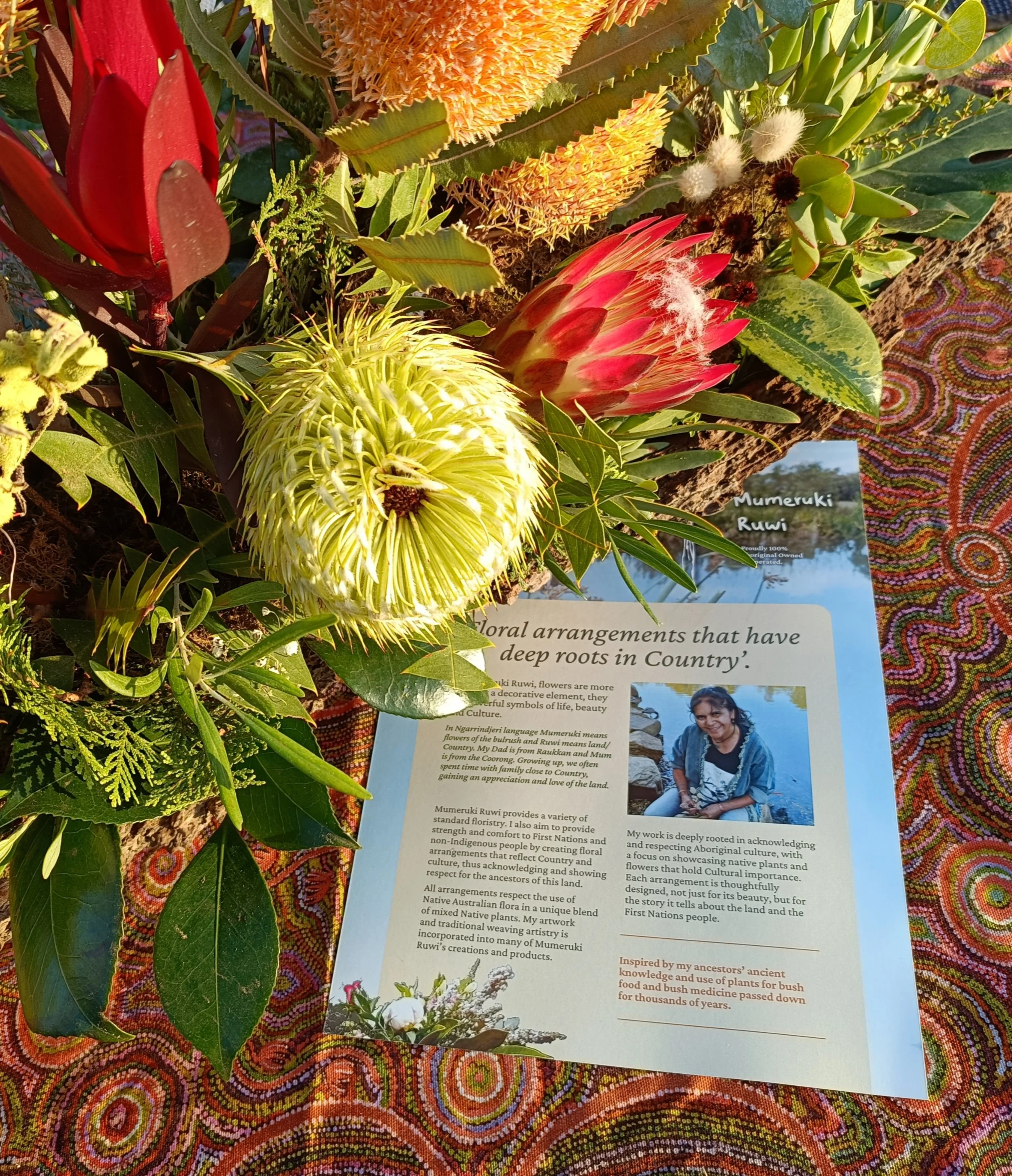  Mumeruki Ruwi - Tanya Karpany Business Profile alongside her floral arrangement. 