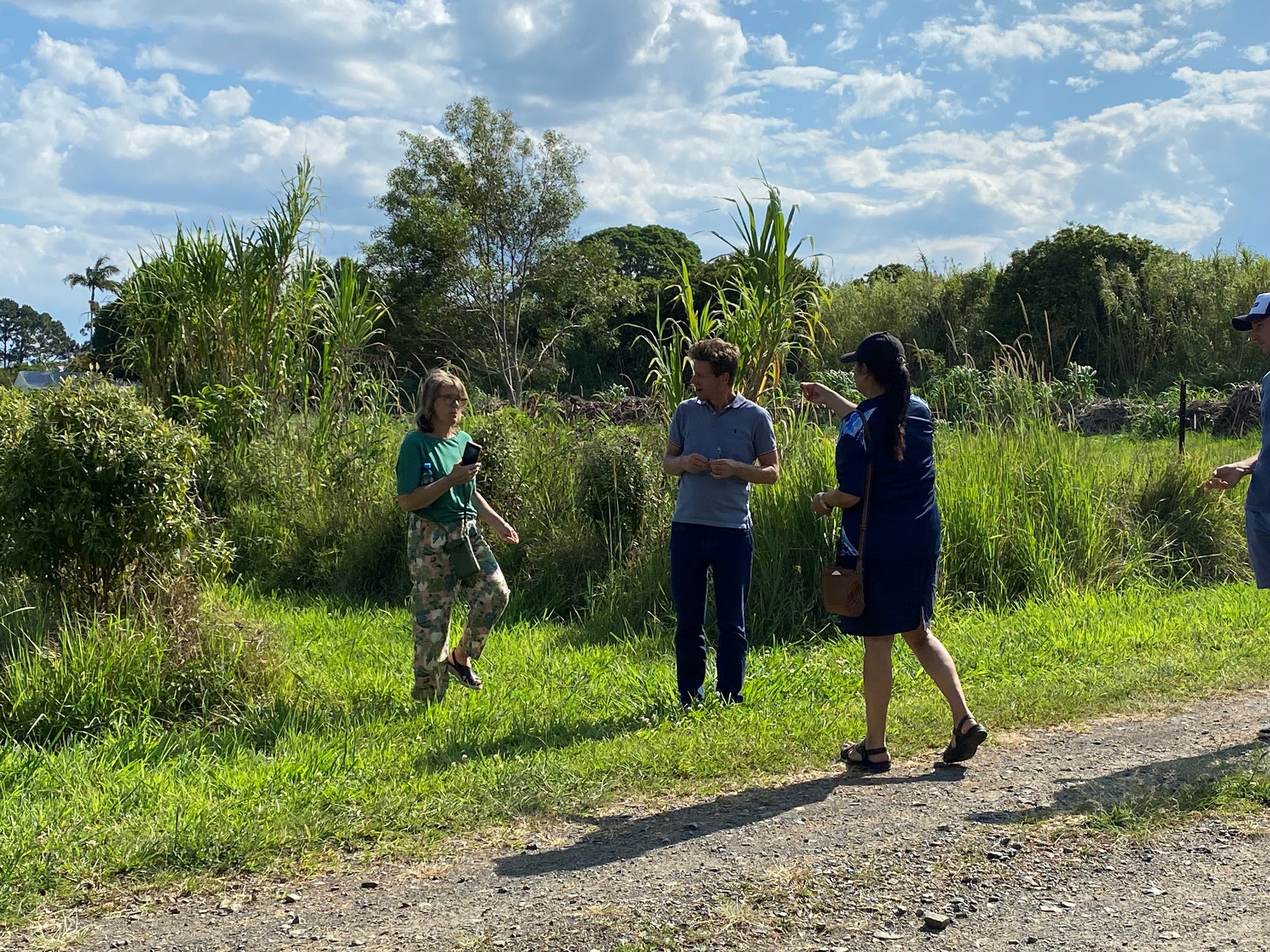  Pictured (left to right): Volunteer Carmen and her husband Rogier being shown around Namabunda Farm by Bundjalung Tribal Society's Manager Melissa 