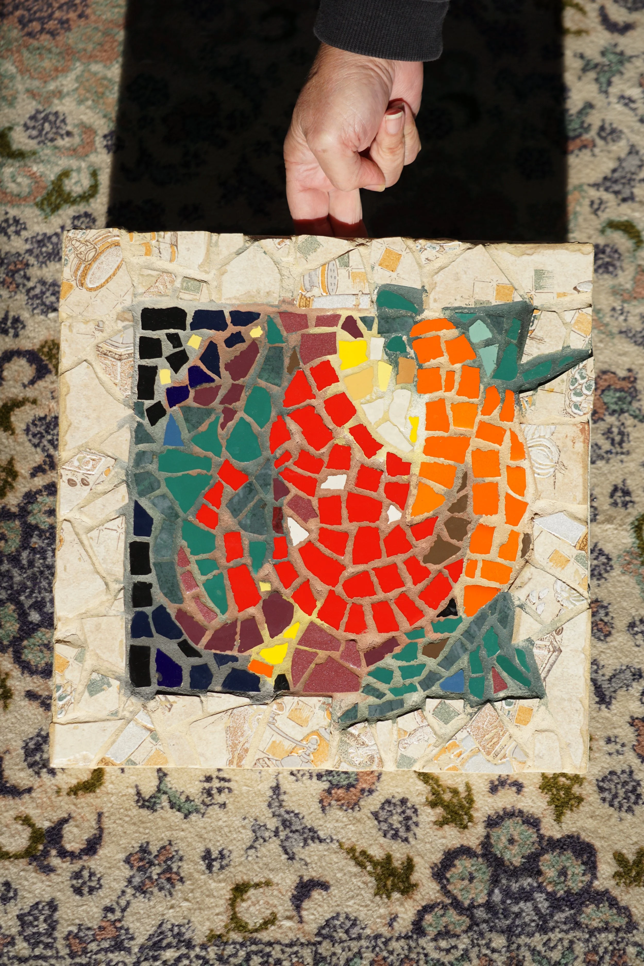  Artist Concetta Morales holds one of her mosaics to catch the light Nov. 23, 2022 in Virginia Beach.  