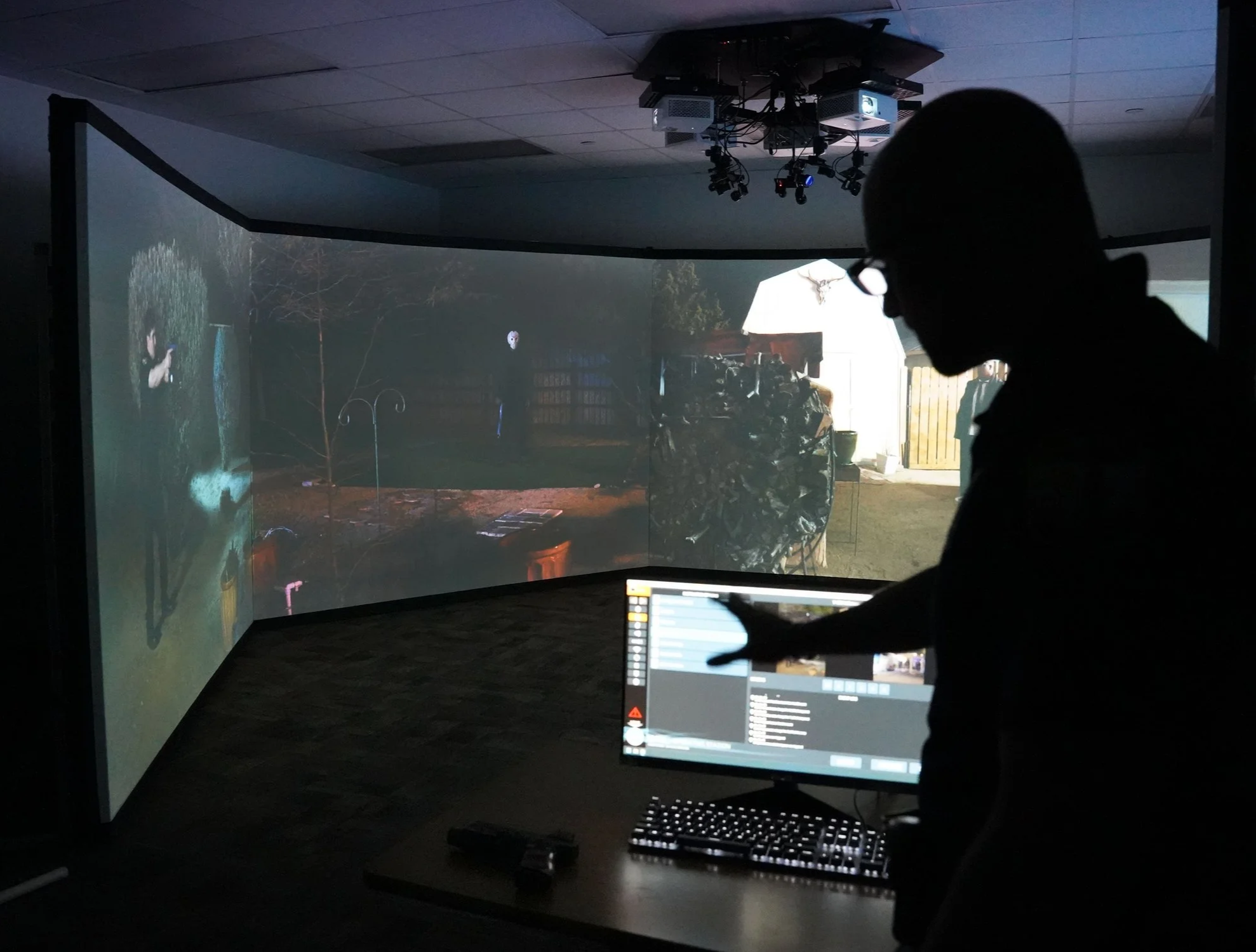  Recruiting Officer Stephen Policella points to a detail on a virtual reality training system March 27, 2025 at the Virginia Beach Law Enforcement Training Academy. The high-tech setup was jerry-rigged in a classroom in the former Seatack Elementary 
