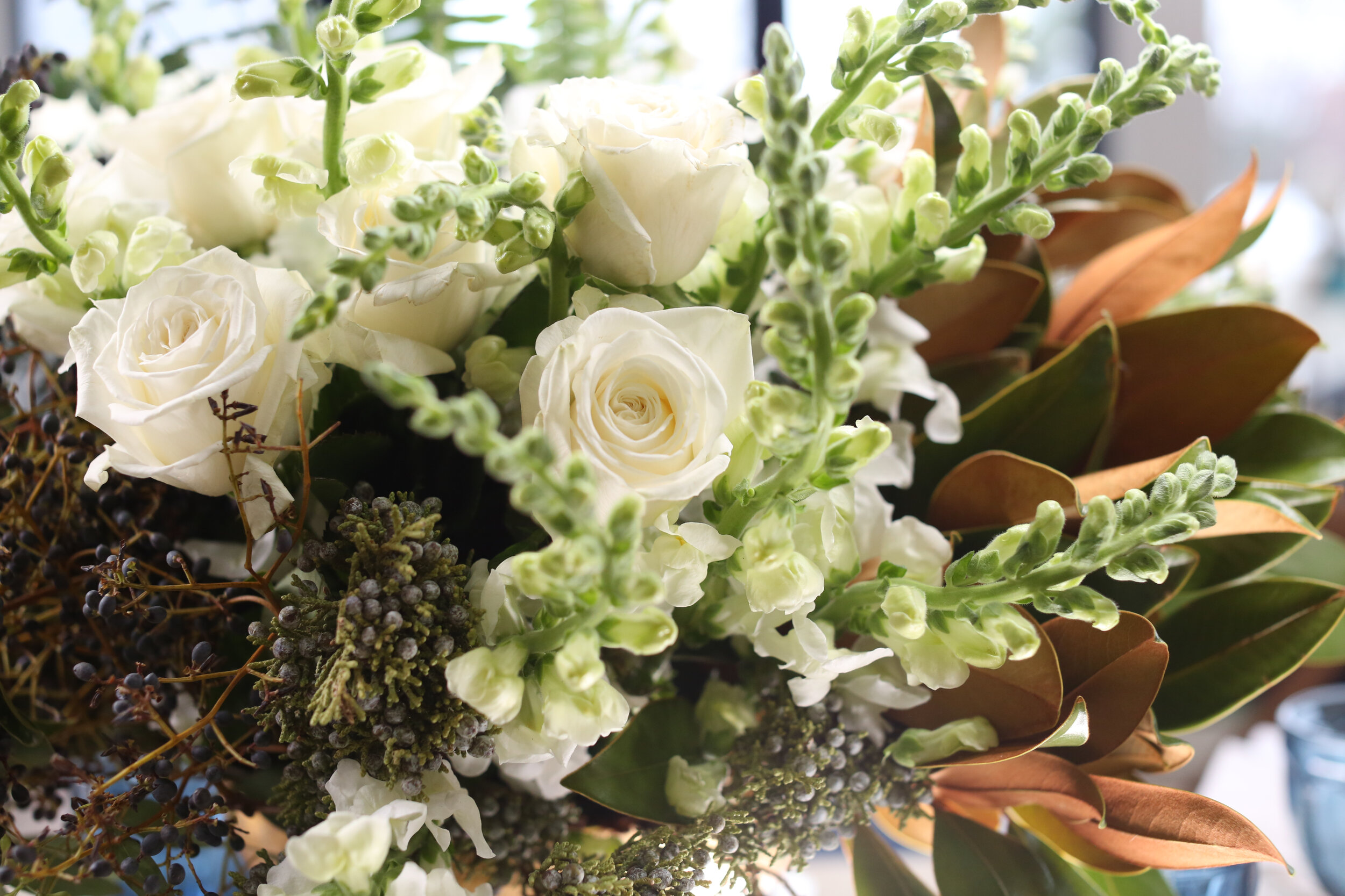 A beautiful fall bouquet with white roses by Darryn Murphy, The China Cabinet's in-house Event Planner 