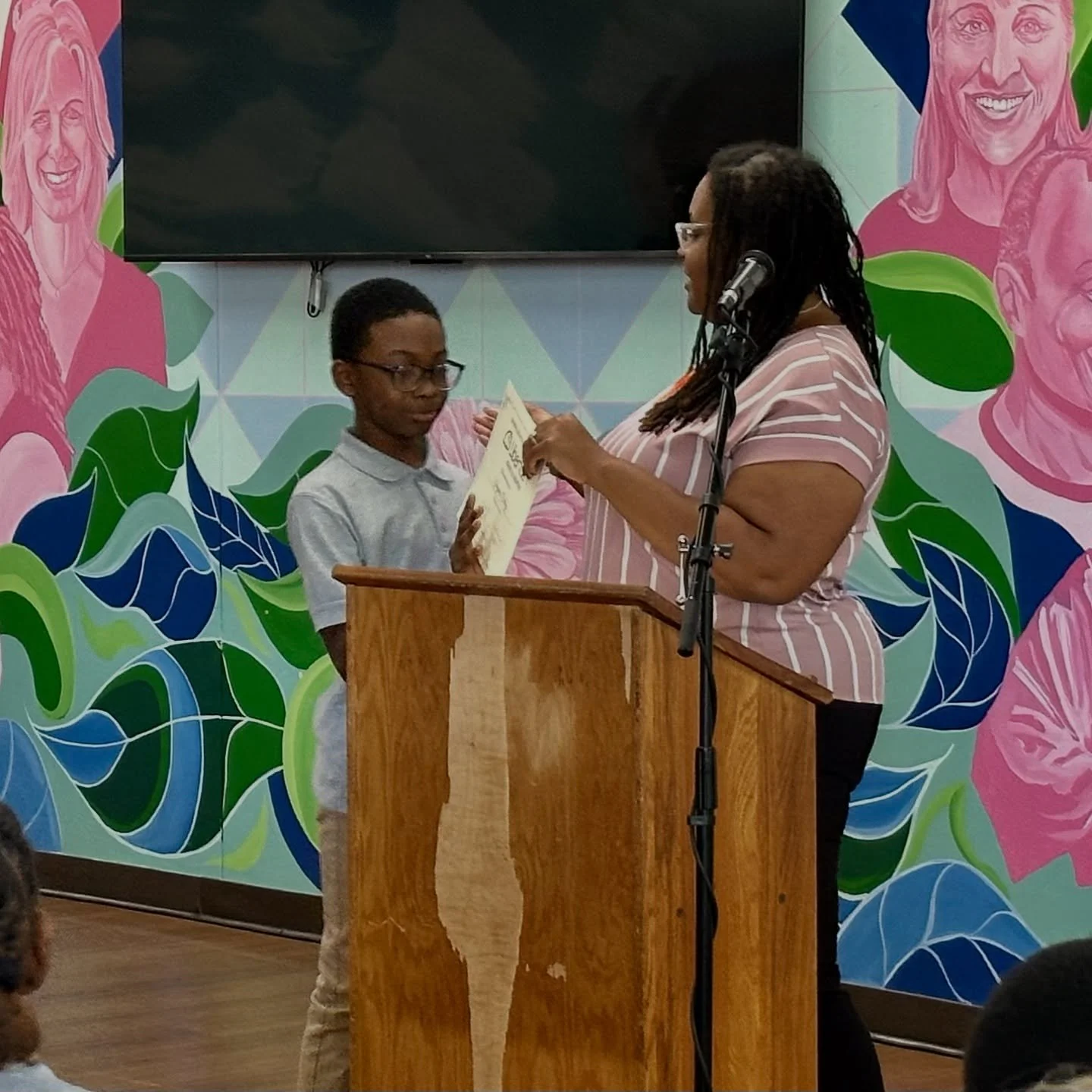 Upper Elementary showing what Wonder, Work, and Love look like at their first quarter assembly and award ceremony.
