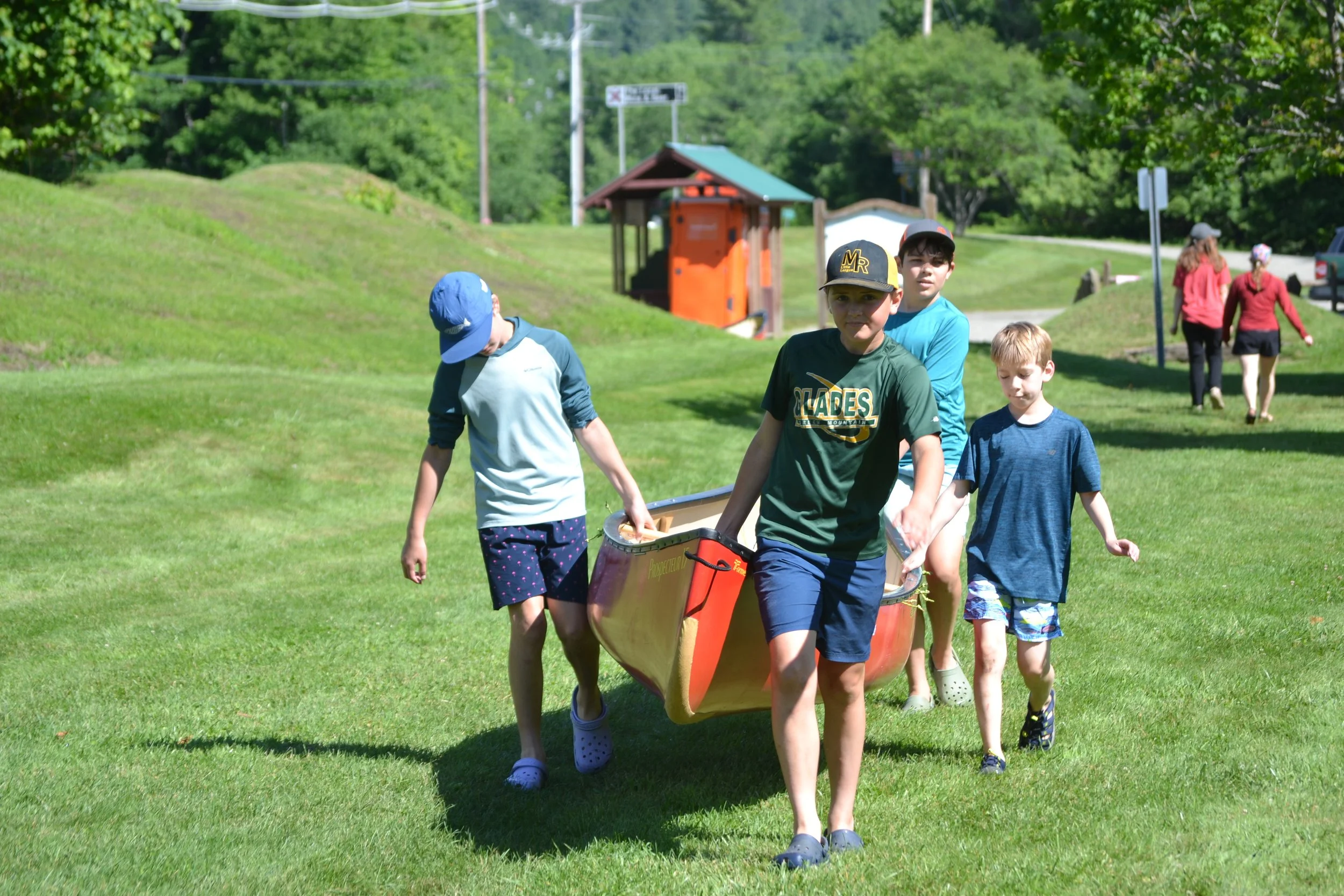 Portaging canoes at Lareau Swim Hole