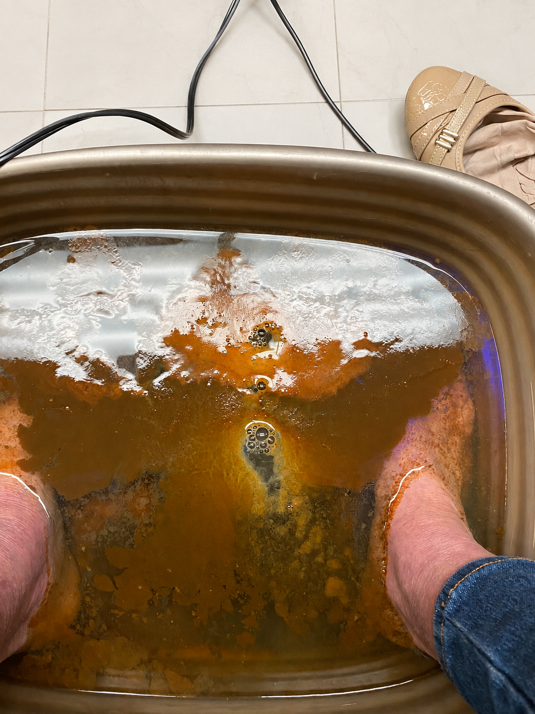 Feet soaking during a Bioresonance Foot Detox session at Elite Retreat Wellness Center in Corbin, Kentucky.