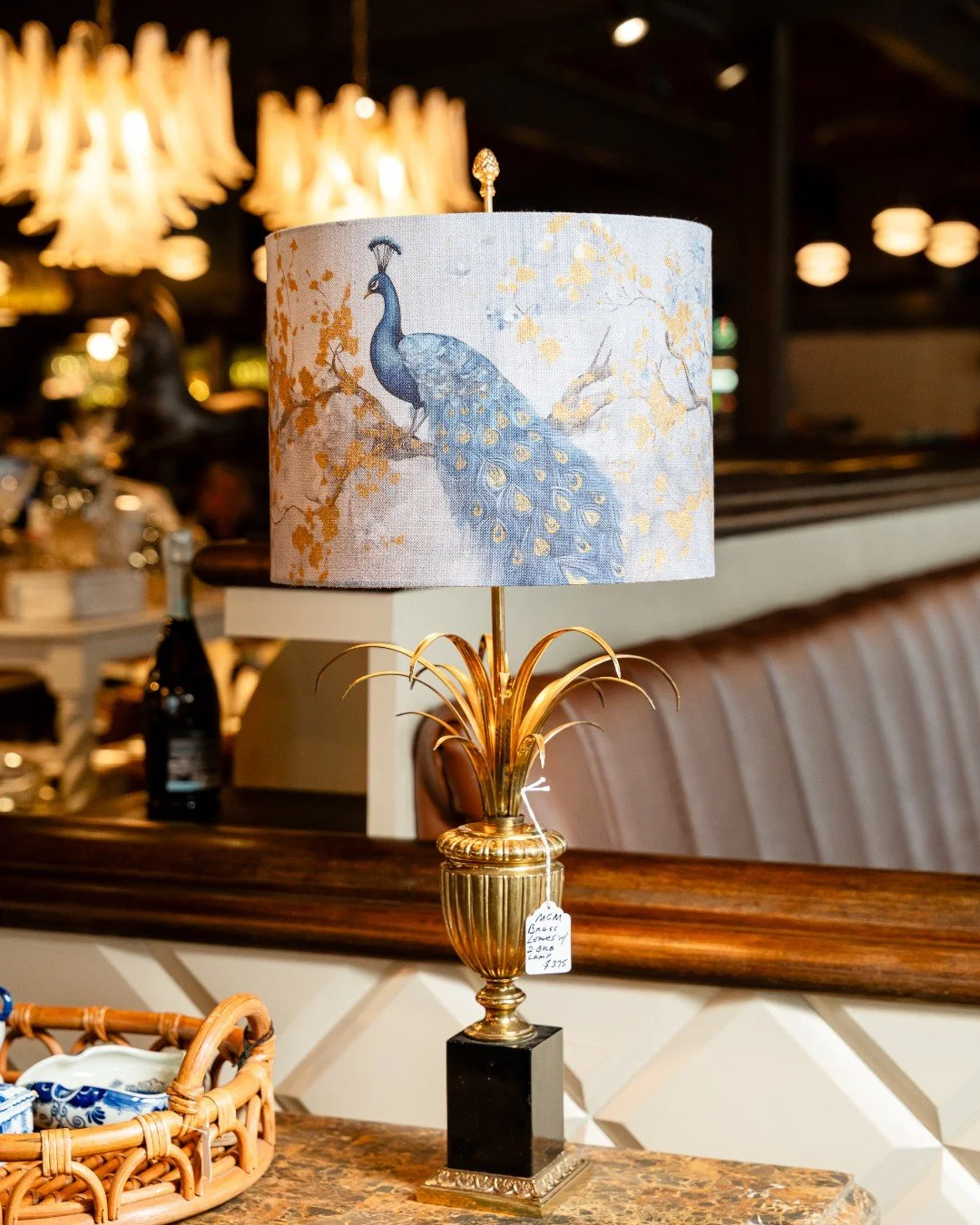 A little drama, a lot of charm. This peacock table lamp pairs a gilded, sculptural base with a soft linen shade illustrated in rich blues and warm golds. Equal parts art and lighting, it&rsquo;s the kind of piece that anchors a room and sparks conver