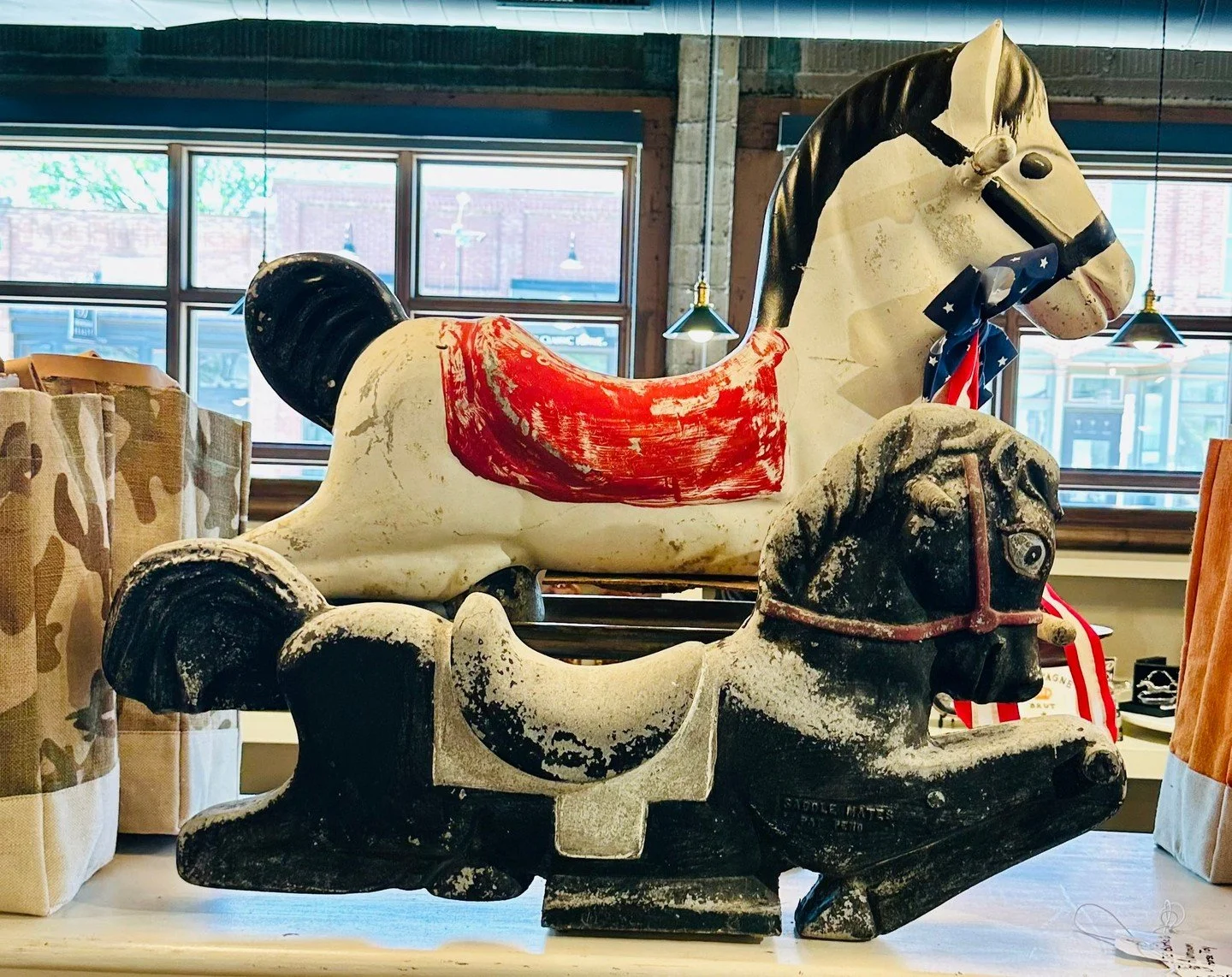 This vintage cast aluminum hobby horse was originally designed for playgrounds and has all the character that only decades of use can create. The worn paint, sturdy construction, and nostalgic design make it an eye-catching conversation piece with en