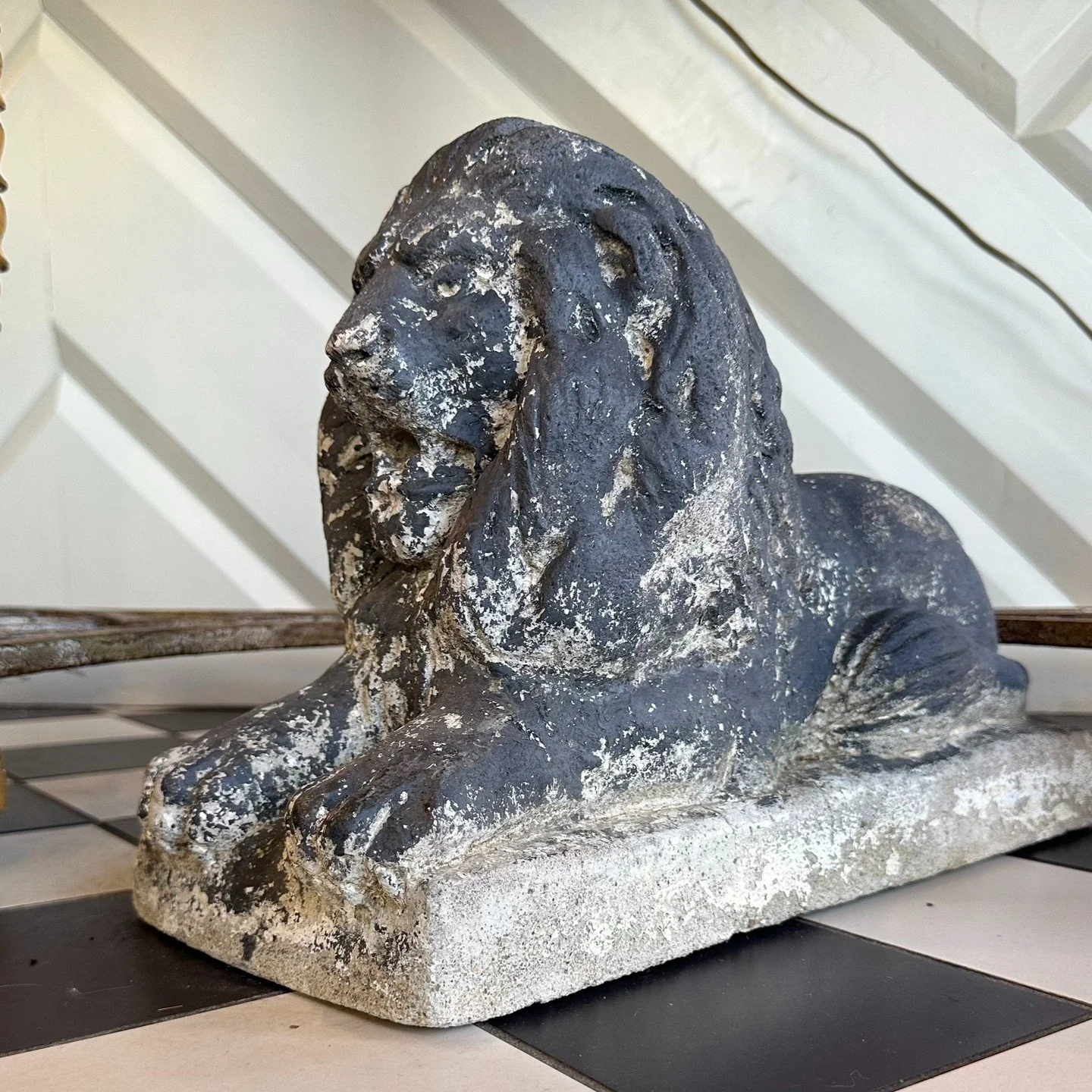 This stately vintage cement lion has decades of character worn right into its surface. The weathered finish, classic pose, and substantial weight give it the kind of presence that works just as well on a front porch as it does in a garden, library, o