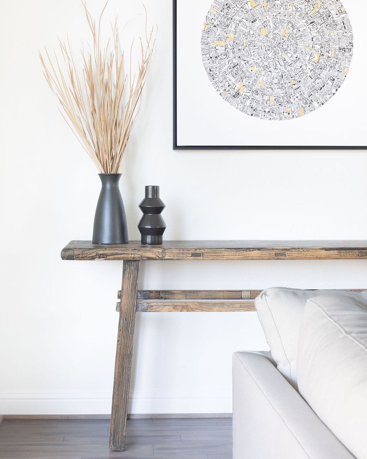 How about that close up? This console table was the perfect amount of rustic for this project, and delivers that authentic look amongst the mostly modern furnishings throughout. A piece that adds character to the space, while the white  backdrop high